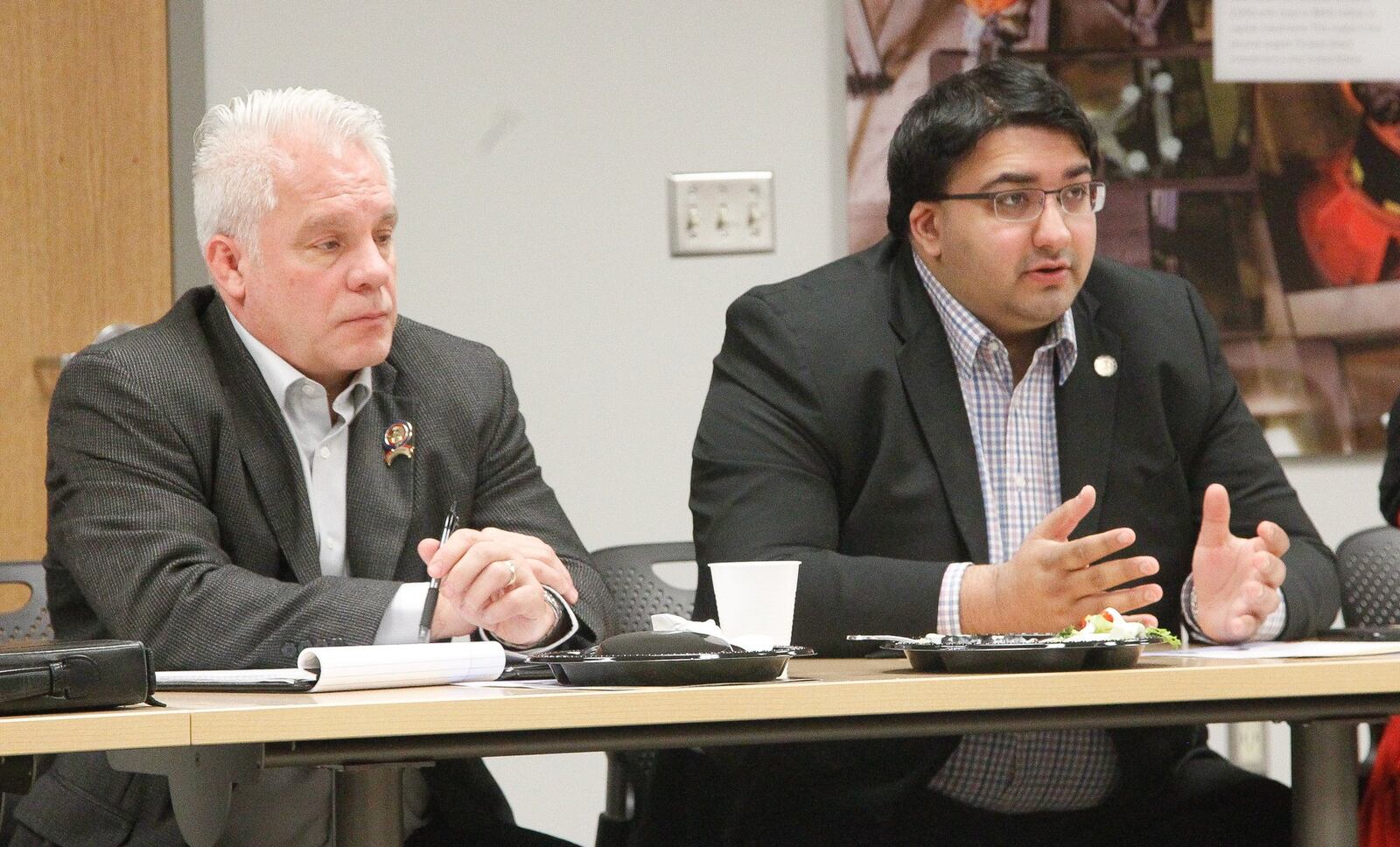 Ohio state representatives Phil Plummer (left), R-Dayton, and Niraj Antani, R-Miamisburg, attend a meeting Friday with Montgomery County commissioners and representatives of the County Commissioners Association of Ohio. CHRIS STEWART / STAFF