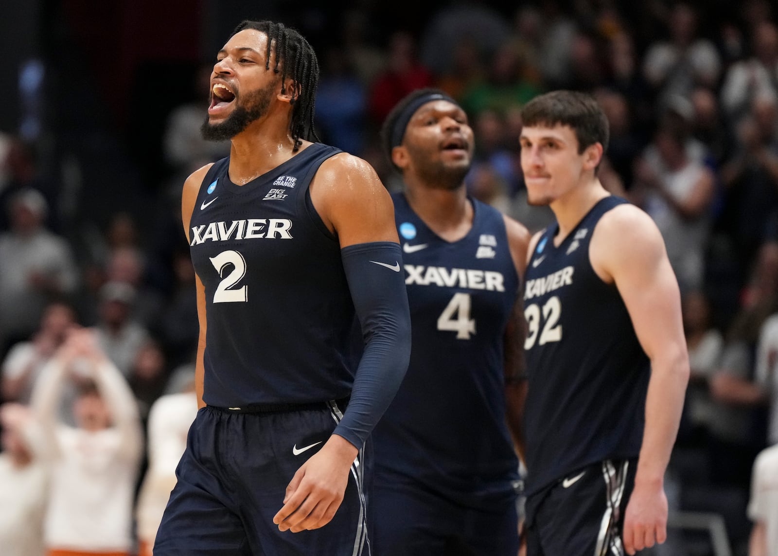 Xavier's Jerome Hunter (2) celebrates with teammates during the second half of a First Four college basketball game against Texas in the NCAA Tournament, Wednesday, March 19, 2025, in Dayton, Ohio. (AP Photo/Jeff Dean)