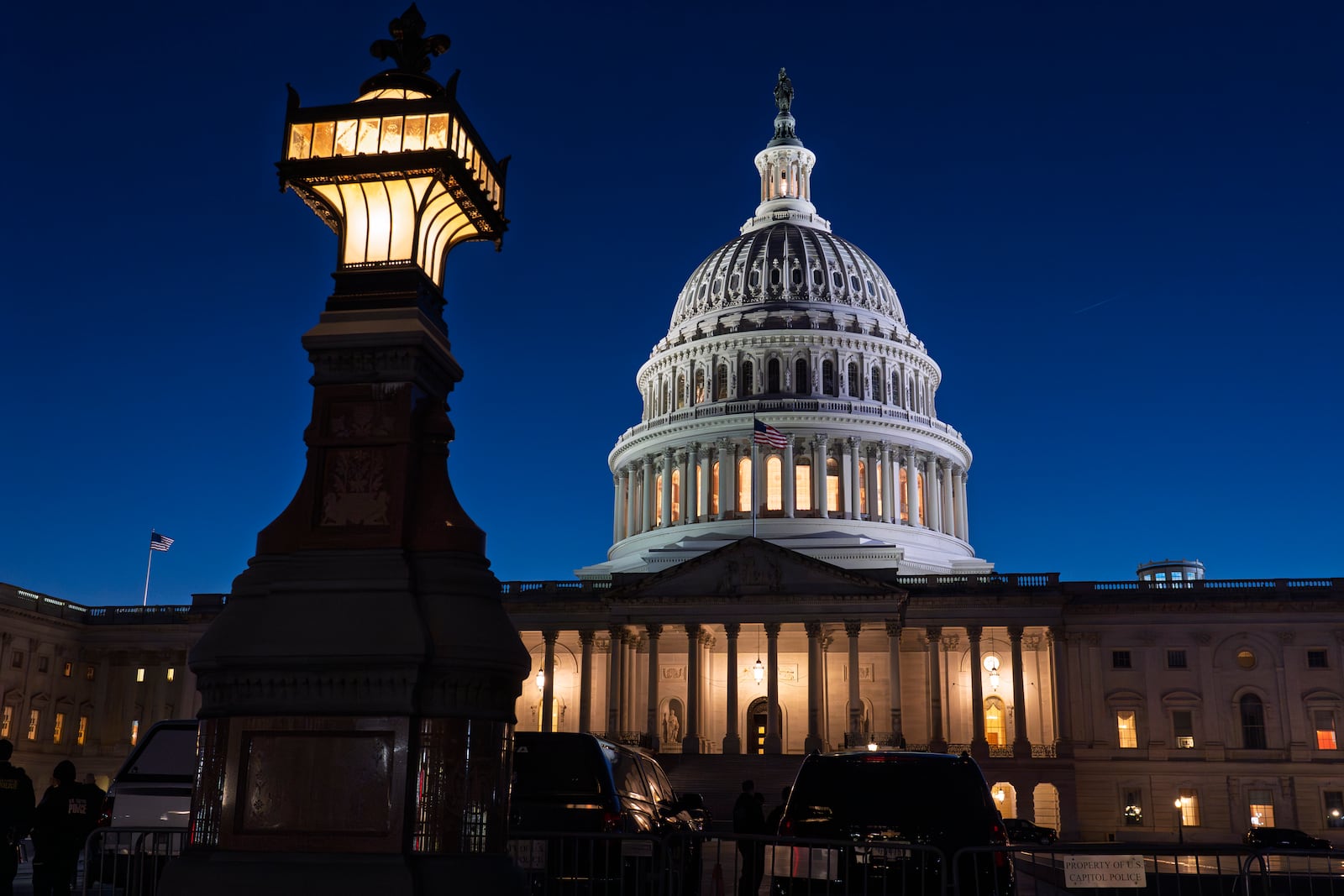 The U.S. Capitol is illuminated at dusk before President Donald Trump's address to a joint session of Congress, in Washington, Tuesday, March 4, 2025. (AP Photo/J. Scott Applewhite)