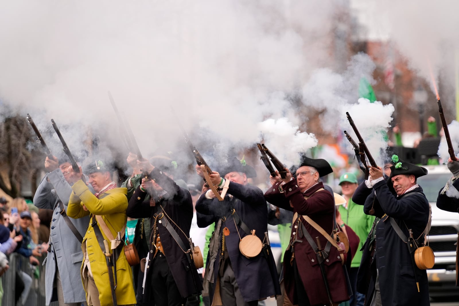 Performers shoot muskets at the St. Patrick's Day parade, Sunday, March 16, 2025, in Boston, Mass. (AP Photo/Robert F. Bukaty)