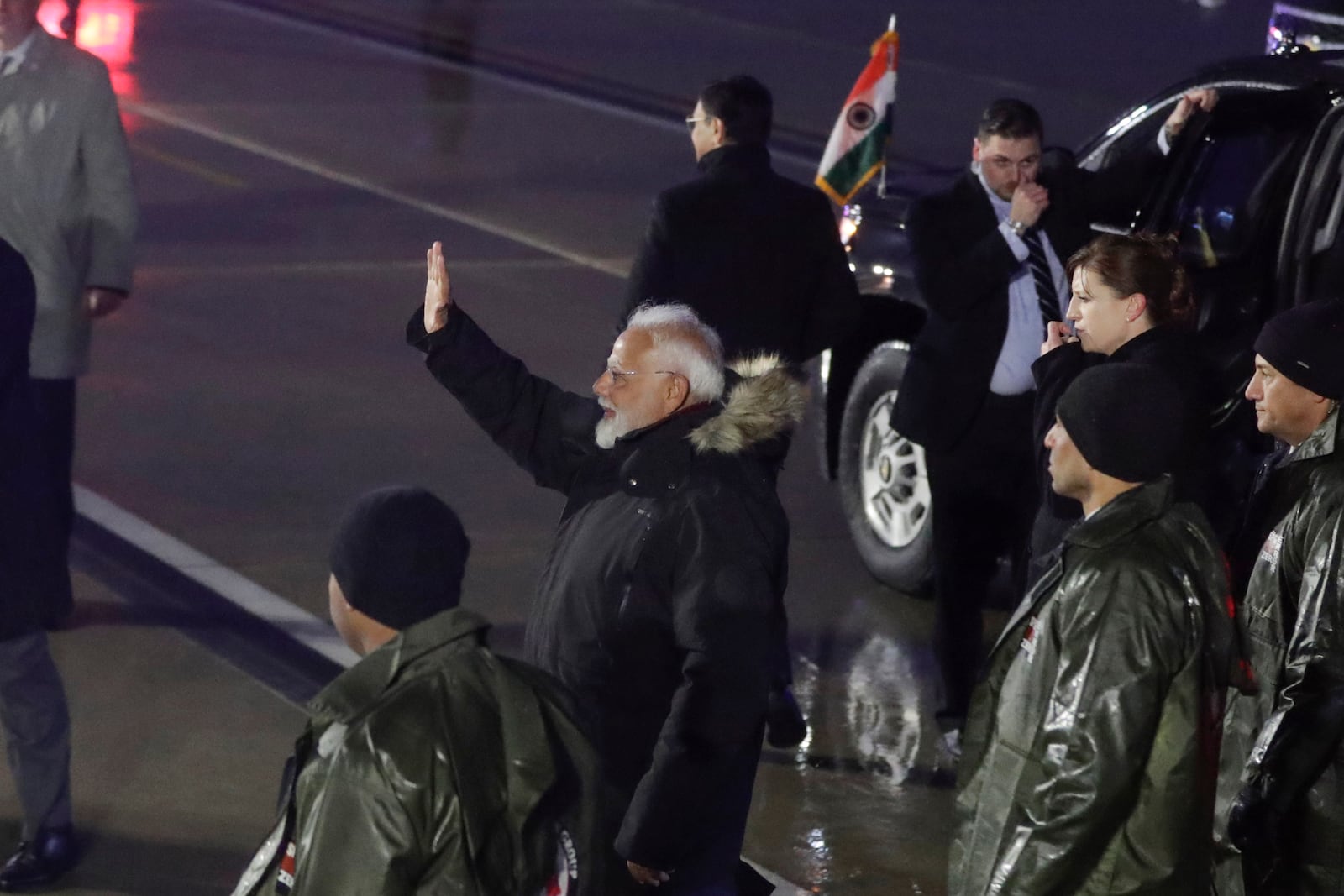 India's Prime Minister Narendra Modi waves to members of the Indian community upon his arrival at Joint Base Andrews, Md., Wednesday, Feb. 12, 2025. (AP Photo/Luis M. Alvarez)