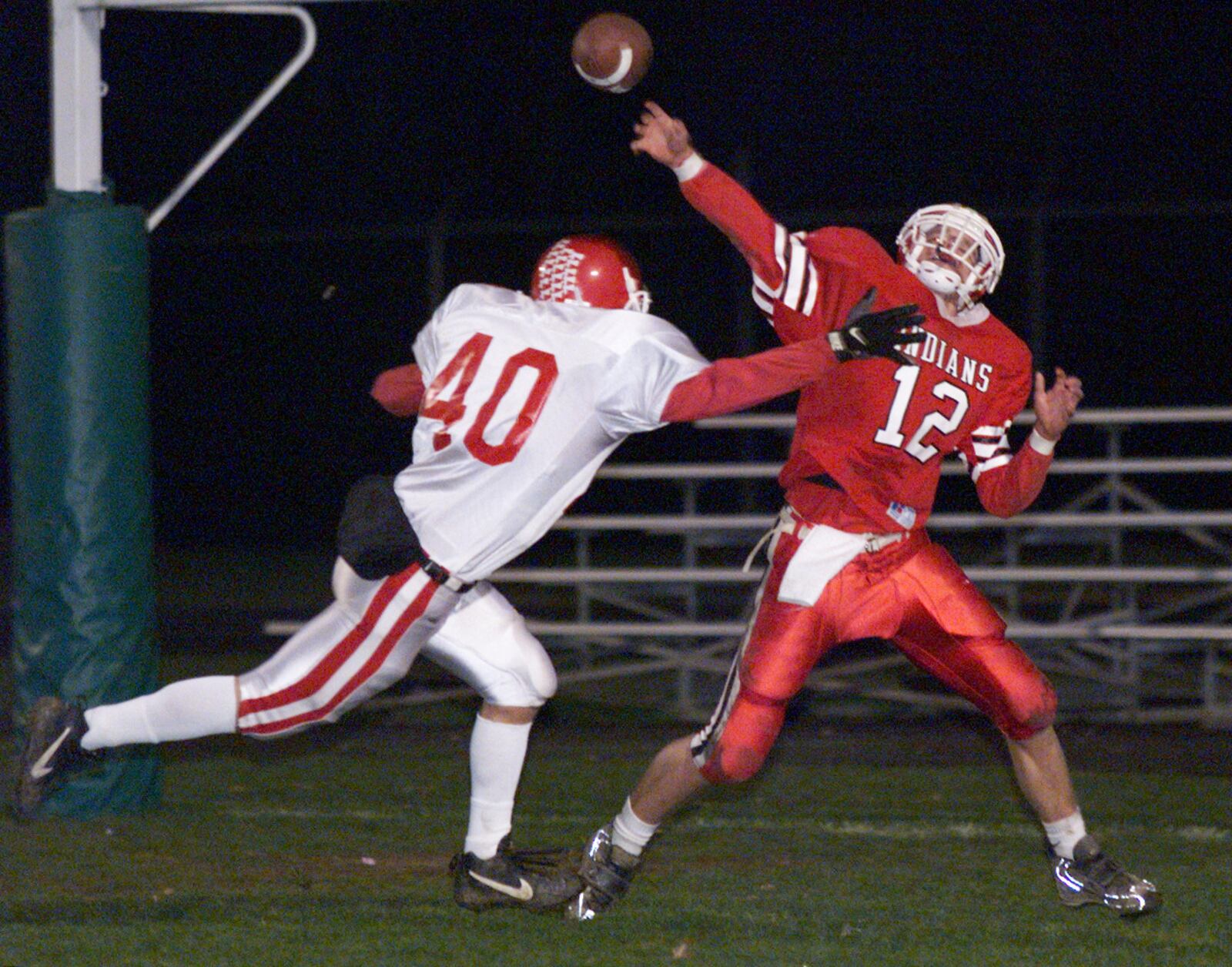 11/14/98; HIGH SCHOOL FOOTBALL: 11/13/98 -- 1113CEDARVILLEP-A -- CEDARVILLE'S JASON HOWARD DUMPS THE BALL WITH ST. HENRY TONY KREMER ON TOP OF HIM, BUT IT WAS TOO LATE TO AVOID A SAFETY CALL DURING 1ST QUARTER PLAY OF FIRST ROUND STATE TOURNAMENT.