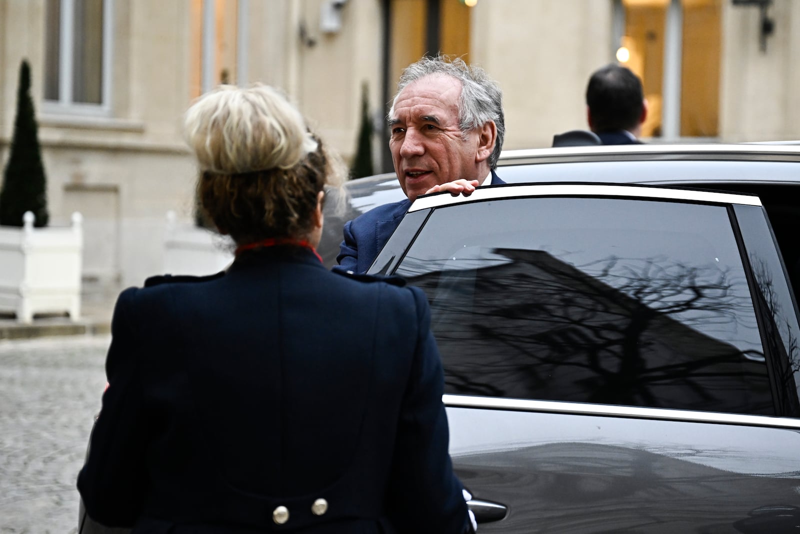 French Prime Minister Francois Bayrou arrives for a meeting at a crisis centre at the Interior Ministry in Paris, Monday Dec. 23, 2024, following the cyclone Chido's passage over the French Indian Ocean territory of Mayotte. French President Emmanuel Macron's office announced a new government Monday, after the previous Cabinet collapsed in a historic vote prompted by fighting over the country's budget. (Julien de Rosa, Pool via AP)