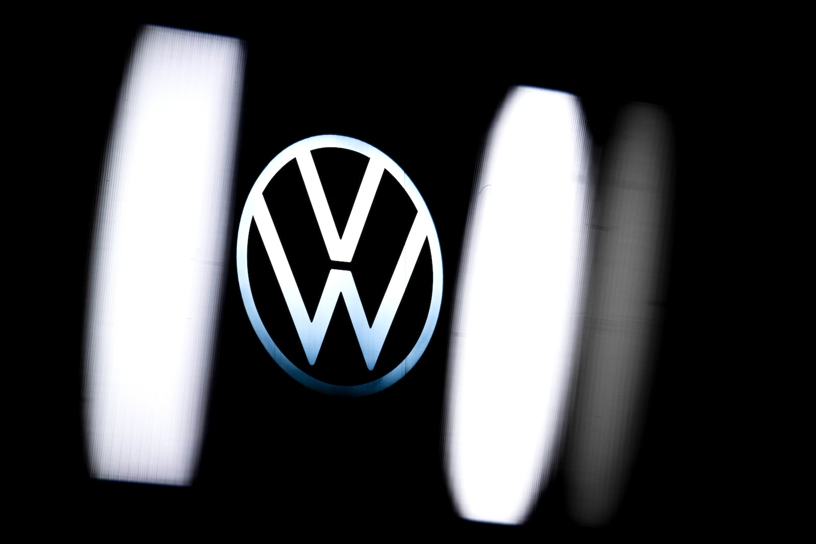 The Volkswagen logo is seen at the company's plant in Emden, Germany, Monday, Dec. 2, 2024. (Sina Schuldt/dpa via AP)