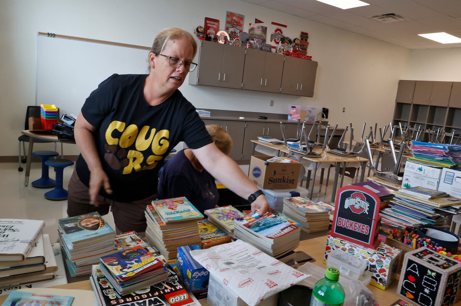 Julie Manion sets up her second grade classroom in the new Kenton Ridge School Friday, August 4, 2023. BILL LACKEY/STAFF