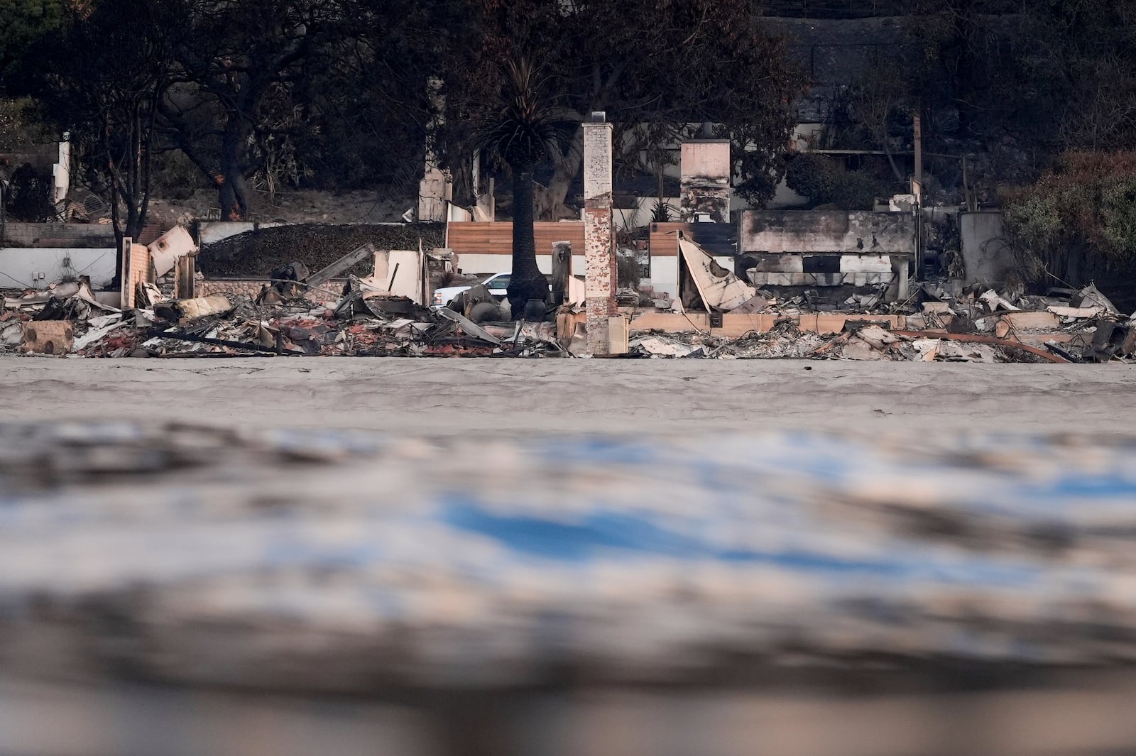 FILE - Properties damaged by the Palisades Fire are seen from a coastline perspective Friday, Jan. 17, 2025 in Malibu, Calif. (AP Photo/Carolyn Kaster, File)