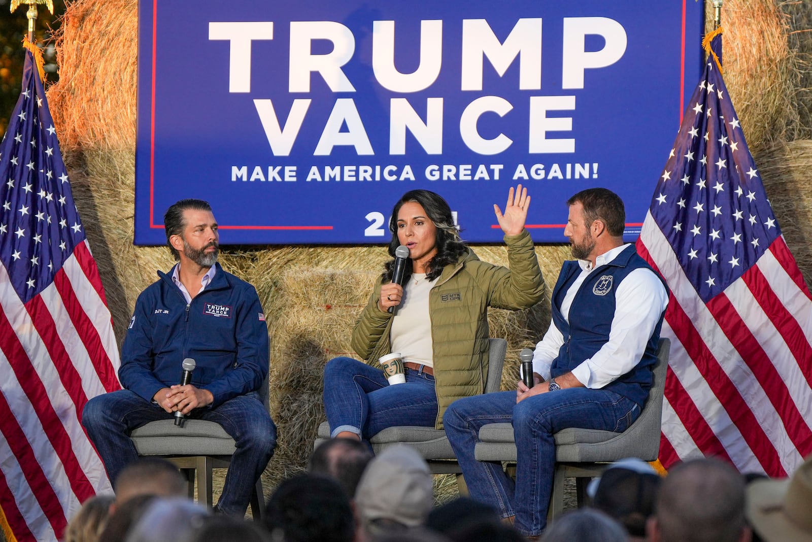 Donald Trump Jr., former Democratic Rep. Tulsi Gabbard and Sen. Markwayne Mullin, R-Okla, speak during a campaign event in support of Republican presidential candidate former President Donald Trump, Friday, Oct. 18, 2024, in Red Springs, N.C. (AP Photo/David Yeazell)