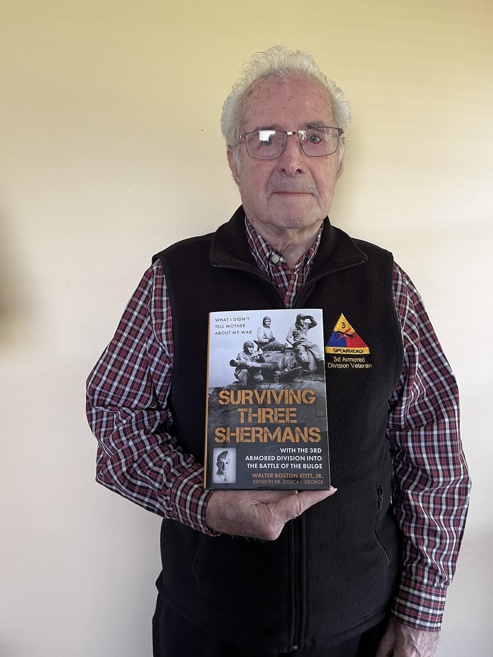 Walter Still holds a copy of his World War II memoir – Surviving Three Shermans: With the 3rd Armored Division Into the Battle of the Bulge …(What I Didn’t Tell Mother  About My War). CONTRIBUTED