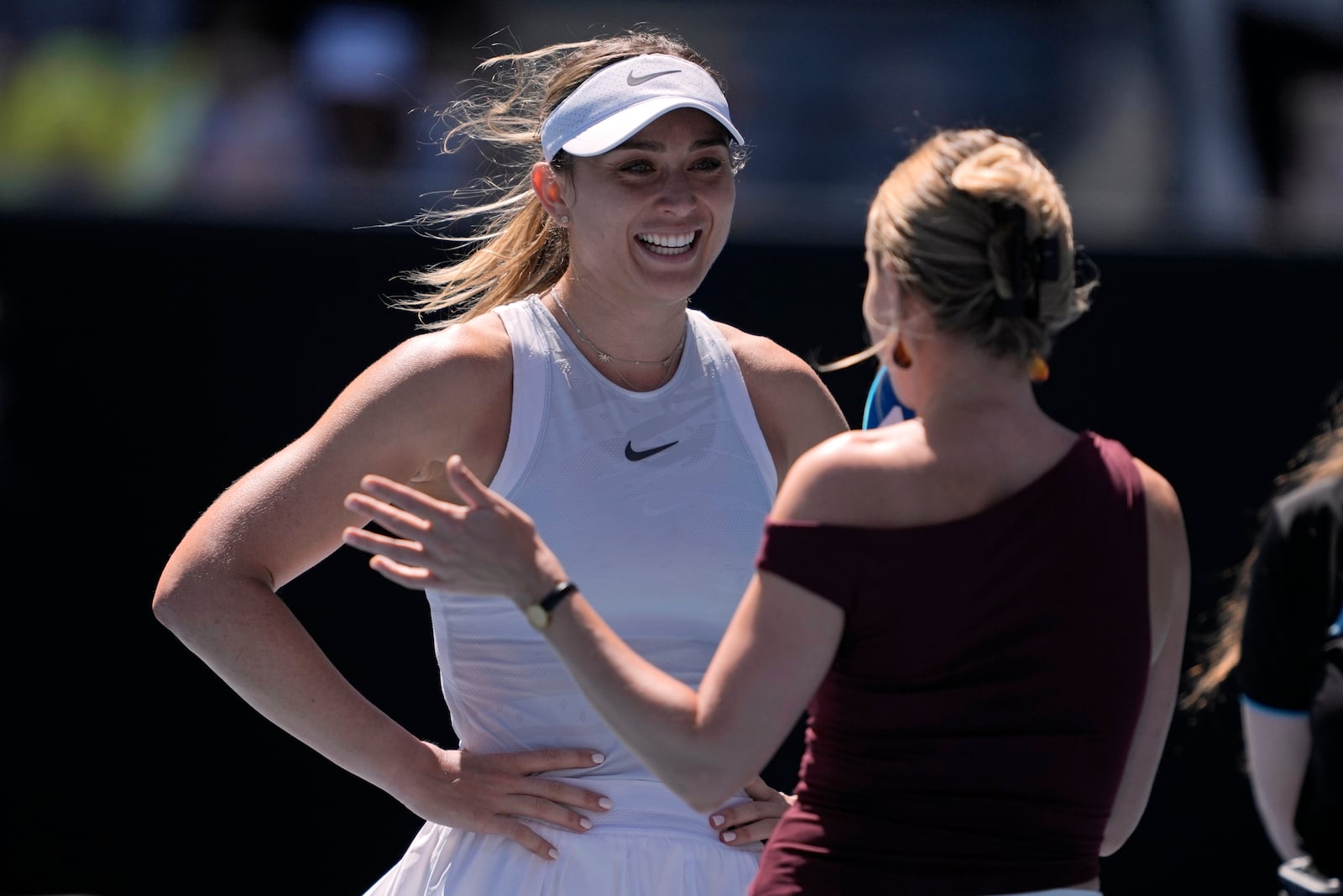 Paula Badosa of Spain reacts as she is interviewed on court following her third round win over Marta Kostyuk of Ukraine at the Australian Open tennis championship in Melbourne, Australia, Friday, Jan. 17, 2025. (AP Photo/Ng Han Guan)