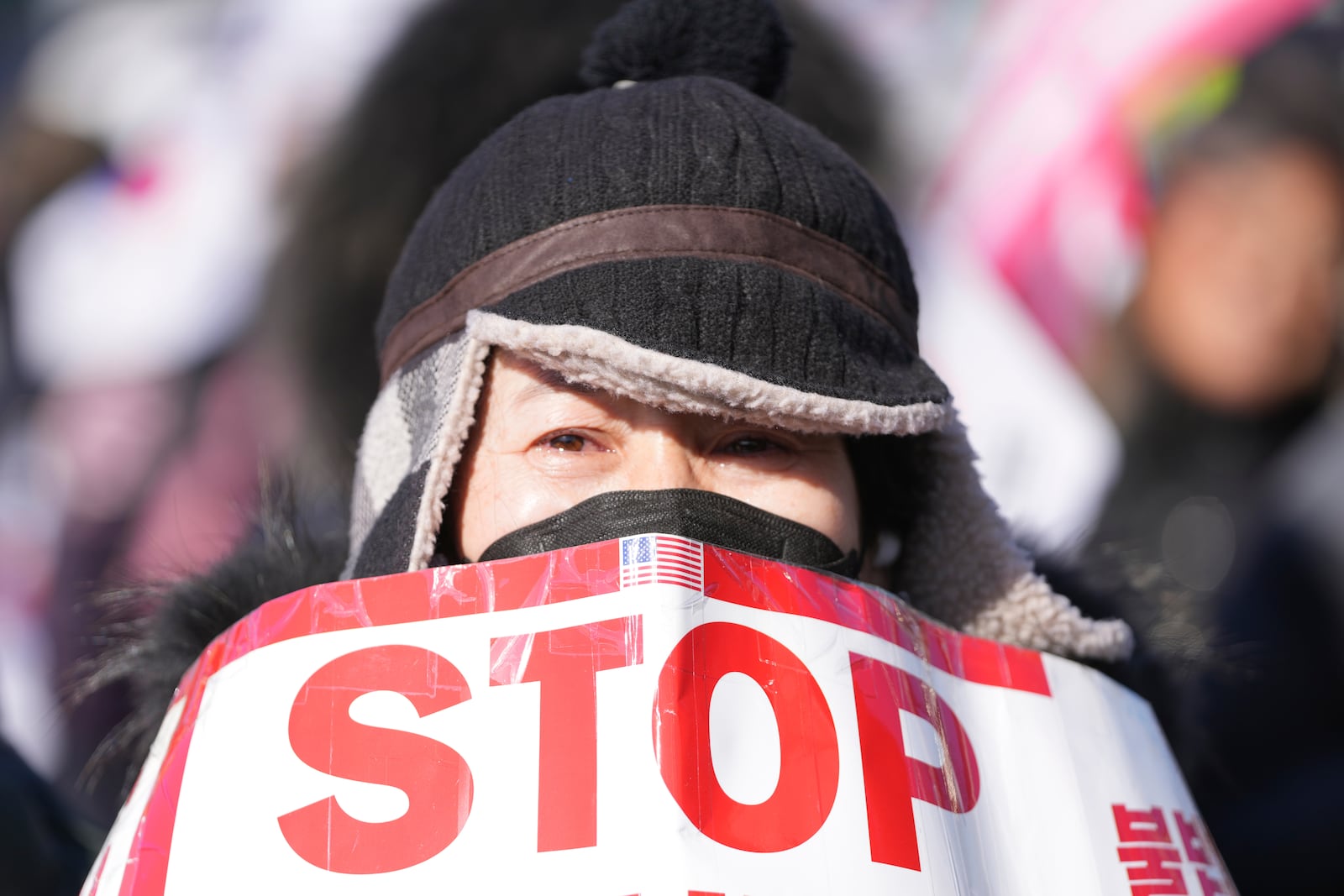 A supporter of impeached South Korean President Yoon Suk Yeol reacts during a rally to oppose his impeachment near the presidential residence in Seoul, South Korea, Wednesday, Jan. 15, 2025. (AP Photo/Lee Jin-man)