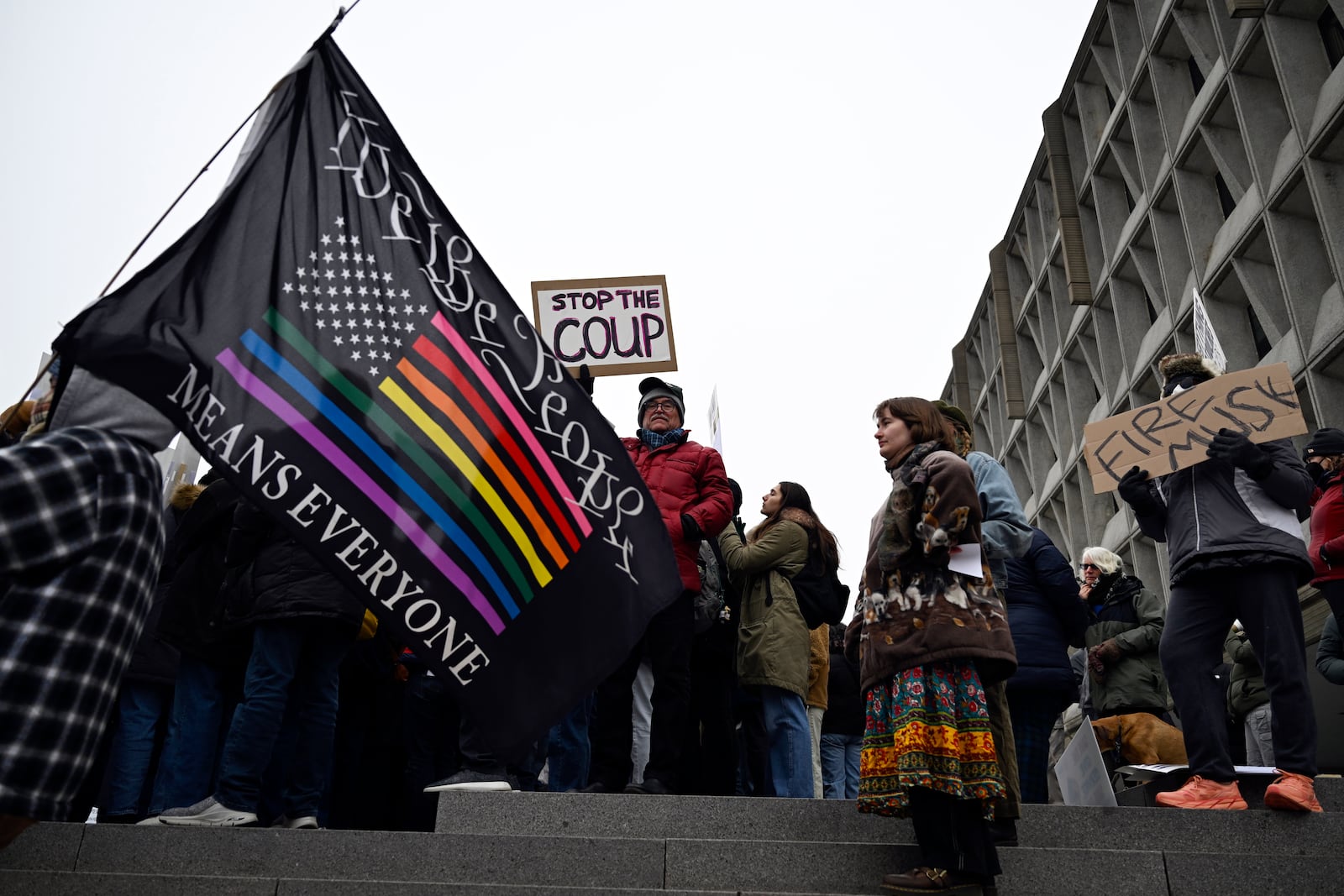 People rally at Health and Human Services headquarters to protest the polices of President Donald Trump and Elon Musk Wednesday, Feb. 19, 2025, in Washington. (AP Photo/John McDonnell)