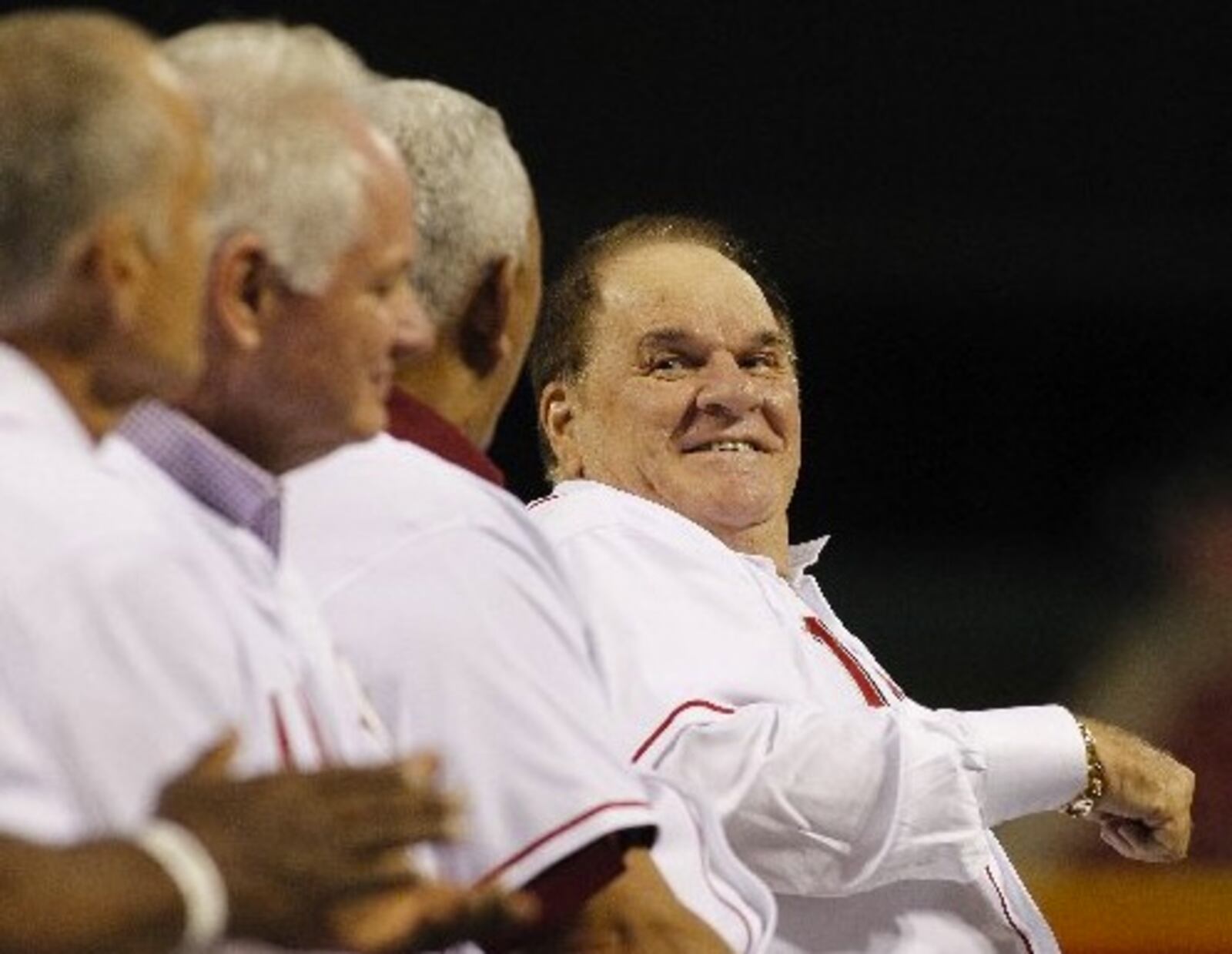 Pete Rose laughs while talking to Dave Concepcion during a ceremony honoring Tony Perez on Friday, Aug. 21, 2015, at Great American Ball Park in Cincinnati. David Jablonski/Staff