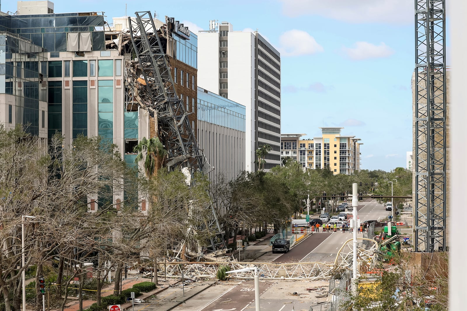 A high rise construction crane broke apart and crashed into the building across the street during Hurricane Milton on Thursday, Oct. 10, 2024, in St. Petersburg, Fla. (AP Photo/Mike Carlson)