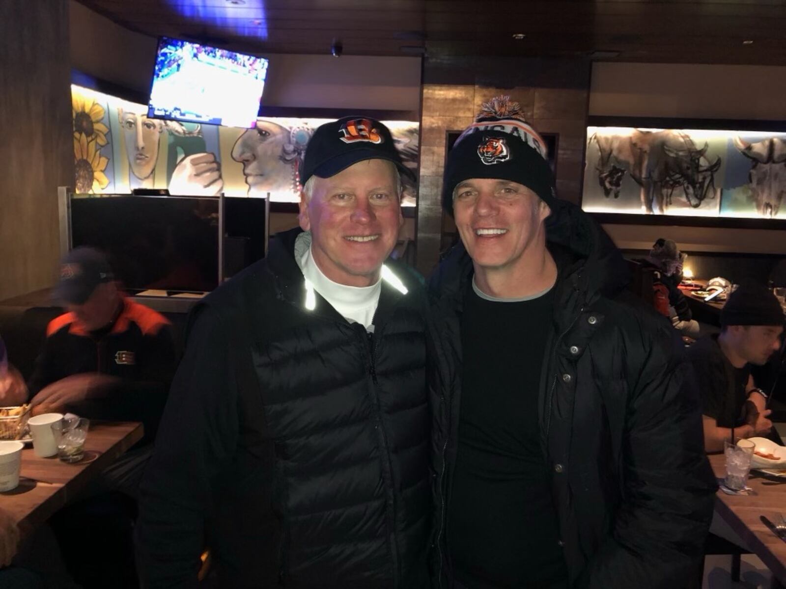 Fox News host and anchor BIll Hemmer wears a Cincinnati Bengals hat he's worn at every playoff game this NFL post season as he's traveled to cheer on his hometown team. He's pictured here with Jimmy Burrow, the father of Bengals QB Joey Burrow. PROVIDED