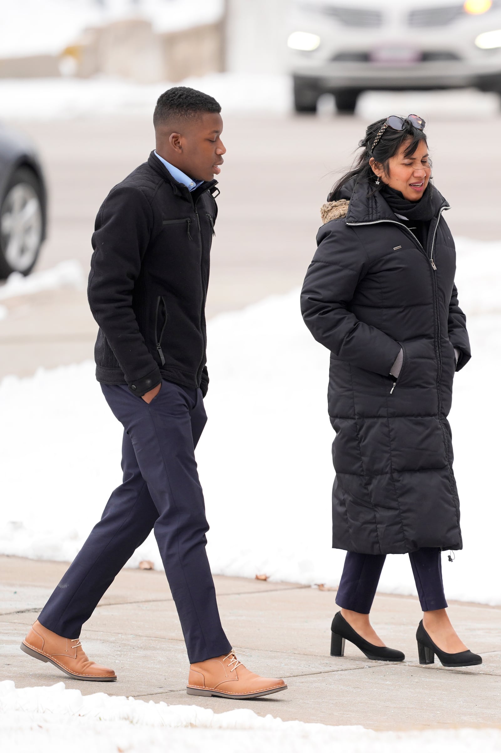 Ralph Yarl walks to the Clay County Courthouse to attend a hearing for Andrew Lester, who pleaded guilty in charges stemming from a 2023 incident when Lester shot Yarl in the head after Yarl mistakenly knocked on the Lester's door, Friday, Feb. 14, 2025, in Liberty, Mo. (AP Photo/Charlie Riedel)