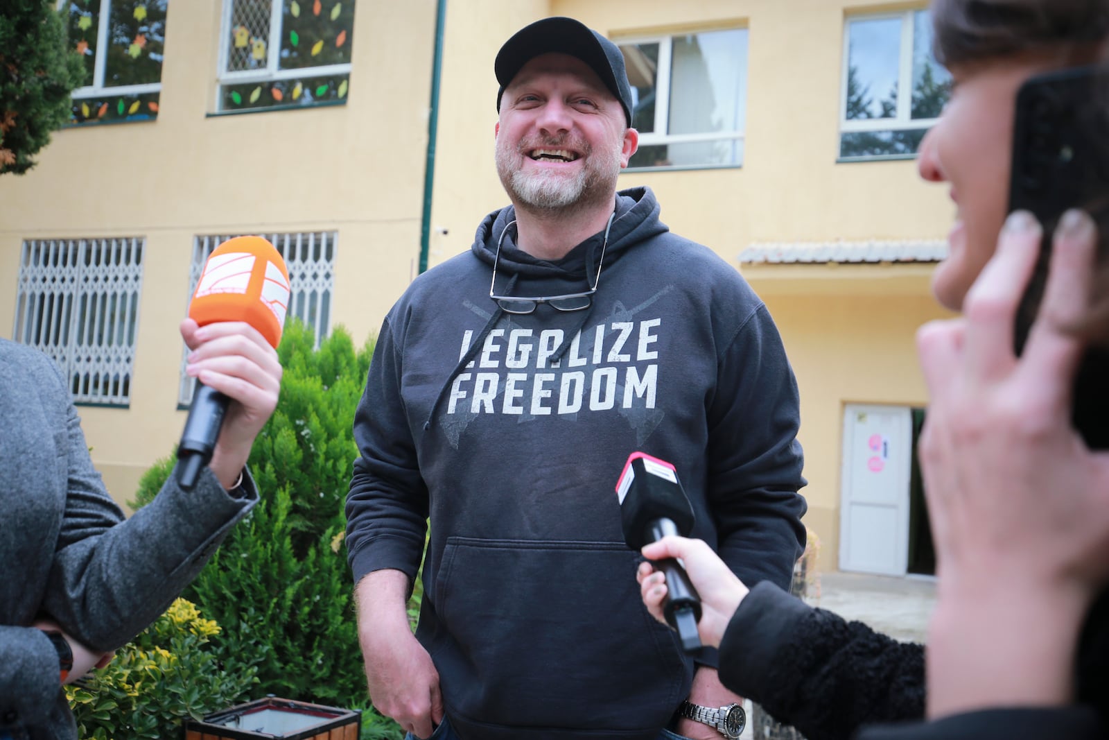 Zurab Japaridze, co-founder and chair of the Libertarian party, speaks to journalists next to a polling station during the parliamentary election in Tbilisi, Georgia, Saturday, Oct. 26, 2024. (AP Photo/Zurab Tsertsvadze)