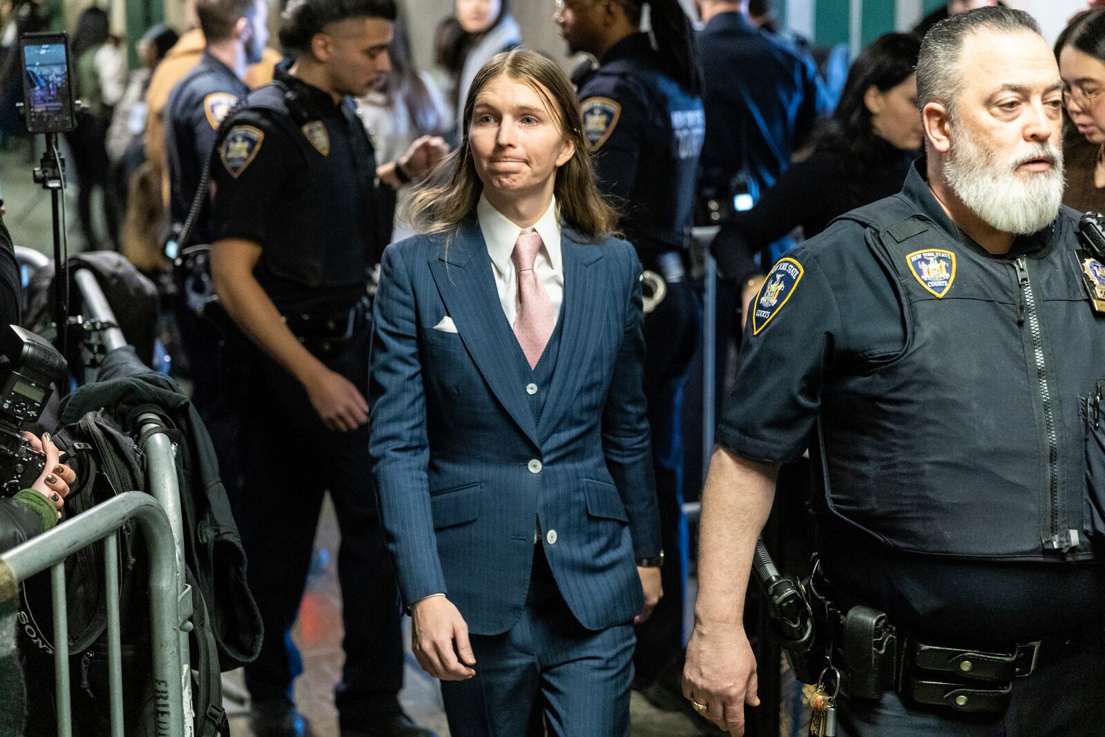 Chelsea Manning walks in the hallway at Manhattan state court on Friday, Feb. 21, 2025 in New York. (AP Photo/Stefan Jeremiah)