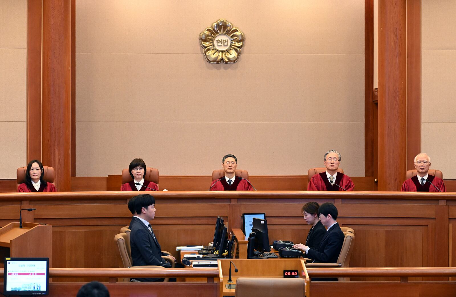 Moon Hyung-bae, acting chief justice of South Korea's Constitutional Court, presides over the impeachment verdict for South Korean Prime Minister Han Duck-soo at the Constitutional Court in Seoul Monday, March 24, 2025. (Kim Min-Hee/Pool Photo via AP)