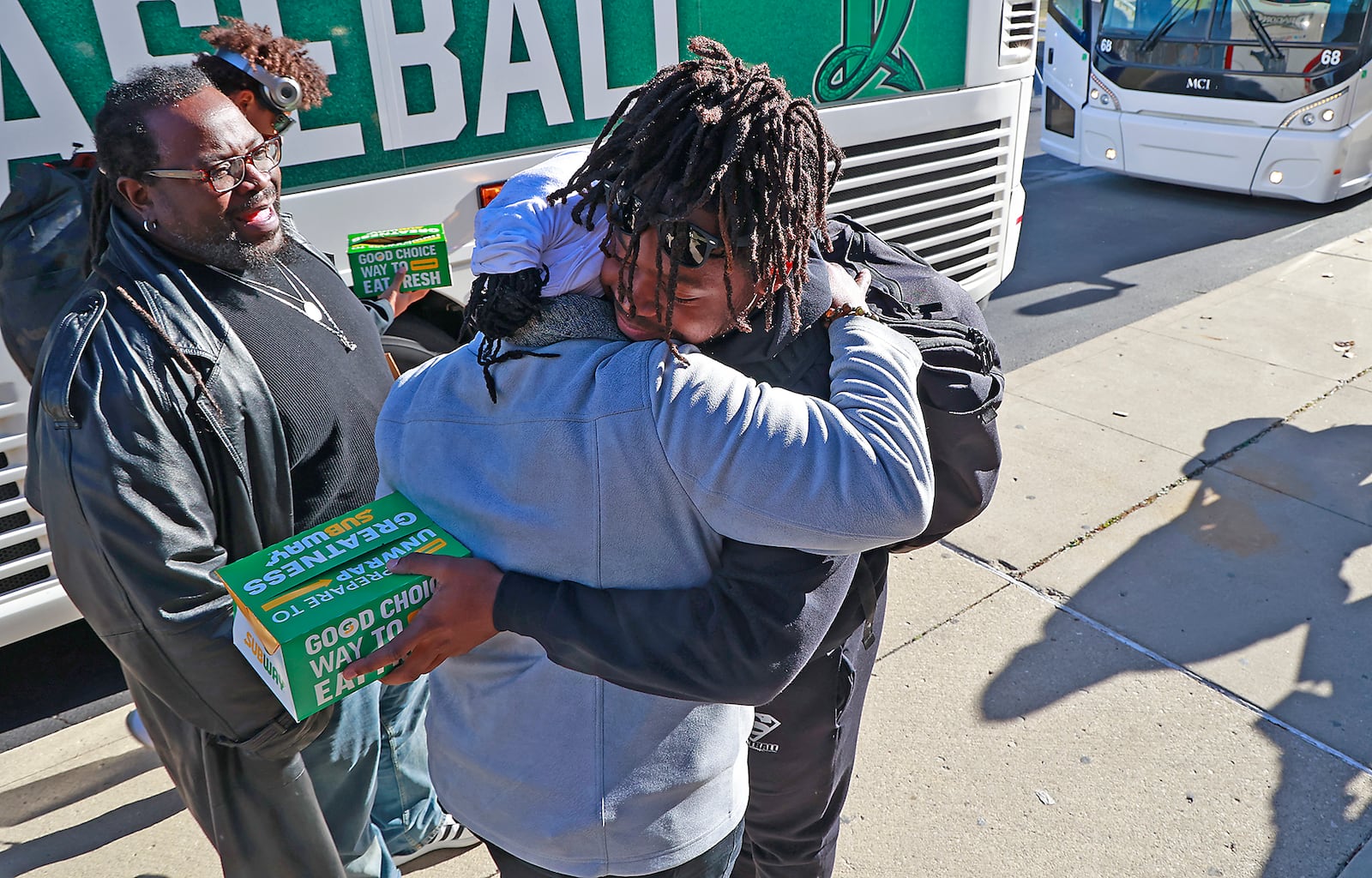 Lucy and Robert Owens say goodbye to the son, Robert Jr., Thursday, Dec. 1, 2022 who was leaving with the rest of the Springfield Wilcats Football Team for their State Championship game in Canton. BILL LACKEY/STAFF