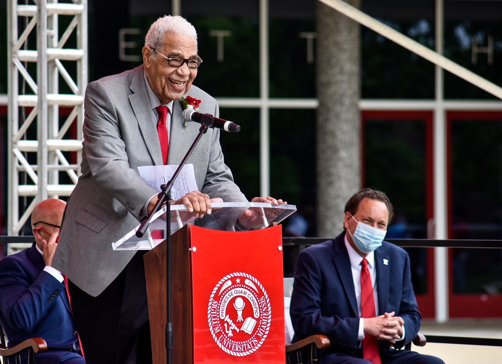 Wayne Embry speaks to a crowd during a ceremony and presentation of the Freedom Summer of '64 Award and unveiling of a statue in his honor Tuesday, May 18, 2021 at Miami University in Oxford. Wayne Embry and his late wife Theresa Embry, both Miami alumni, were awarded the Freedom of Summer of '64 Award for their life's work as civil right champions and mentors. A statue of Wayne Embry in a basketball pose, created by sculptor Tom Tsuchiya, was unveiled in front of Millett Hall and a scholarship in his name was announced to support Miami varsity men's basketball student athletes. NICK GRAHAM / STAFF