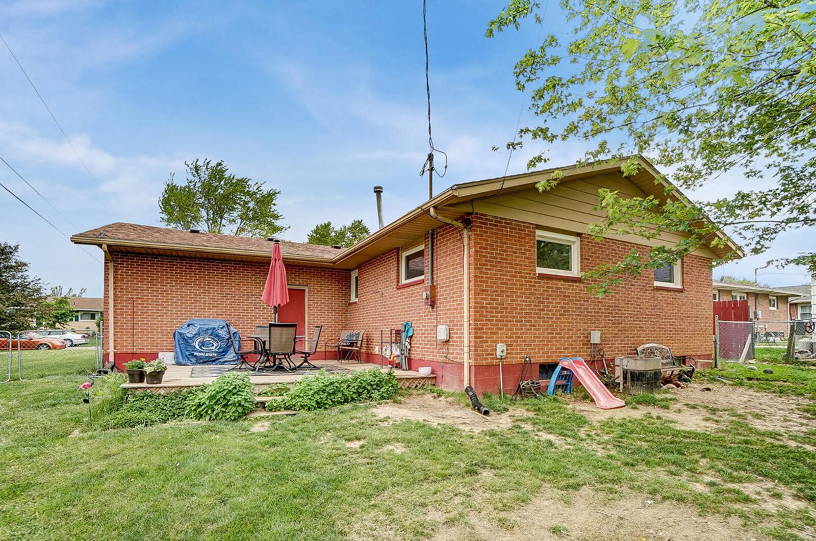 The back yard is fully fenced and features a wood deck and a storage shed. There are no rear neighbors, and the area behind the fence is an open field. CONTRIBUTED PHOTO