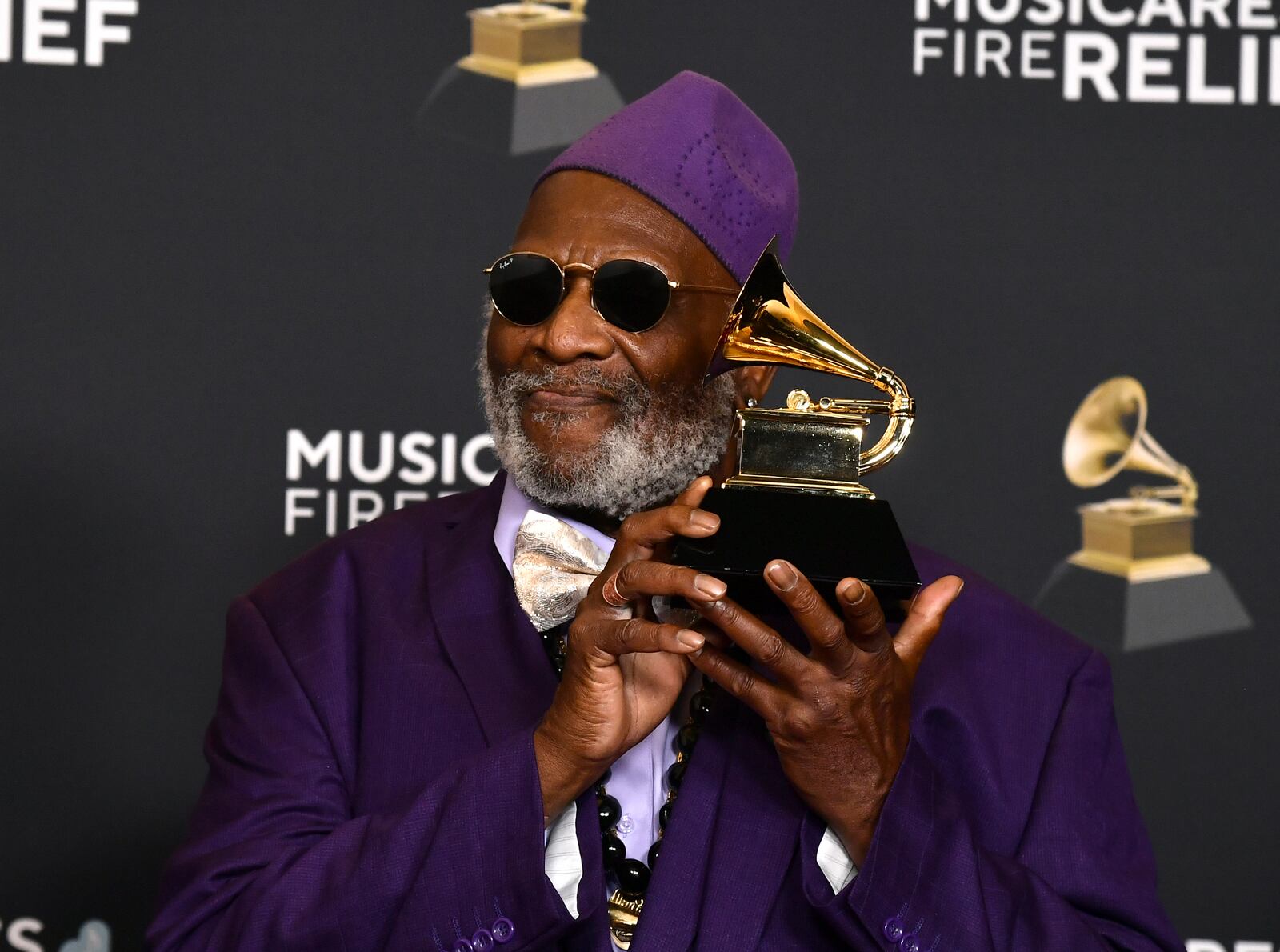 Lifetime Achievement Honoree musician Taj Mahal poses in the press room with the award for traditional blues album for "Swingin' Live at the church in Tulsa" during the 67th annual Grammy Awards on Sunday, Feb. 2, 2025, in Los Angeles. (Photo by Richard Shotwell/Invision/AP)