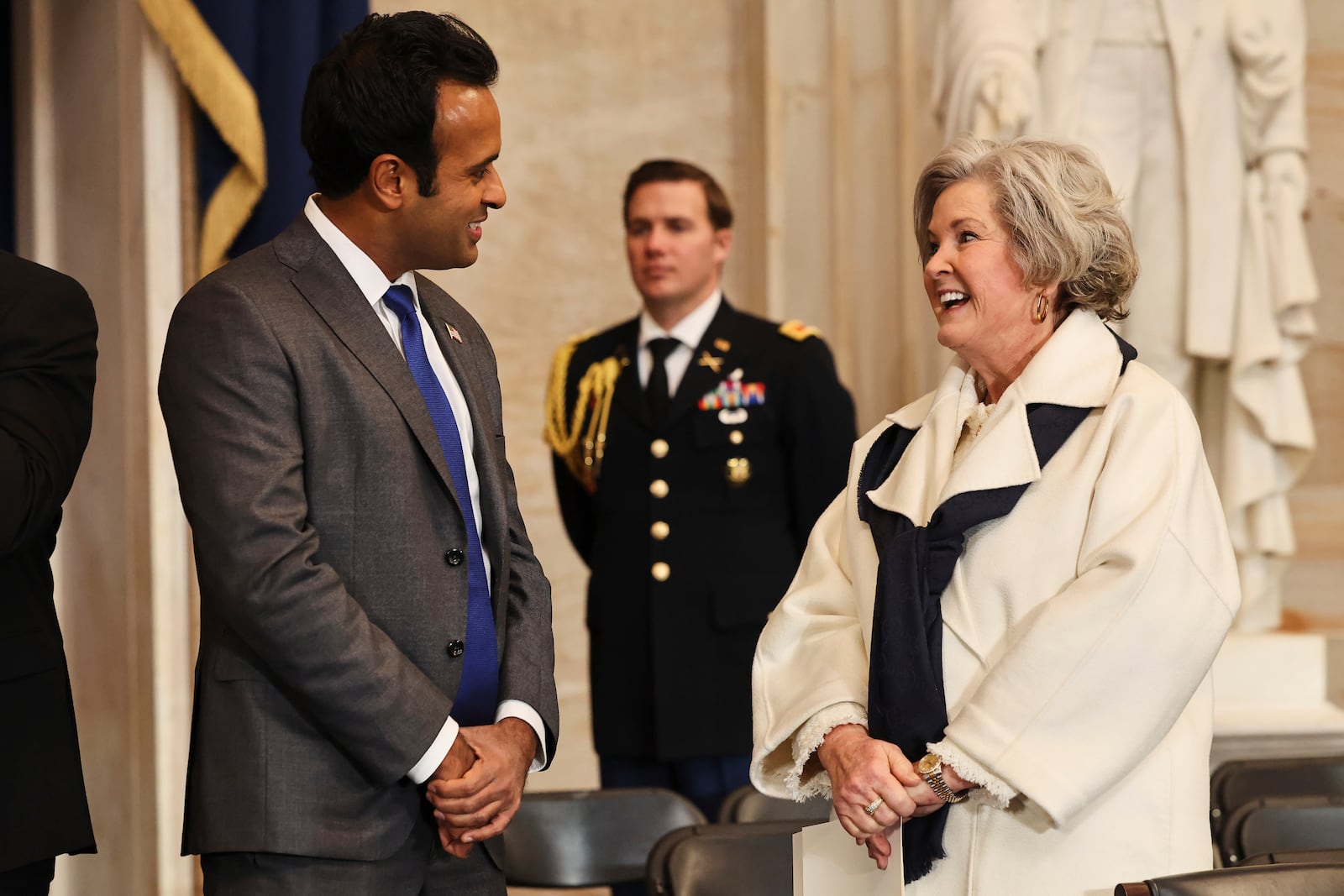 Vivek Ramaswamy, left, speaks with President-elect Donald Trump's Chief of Staff Susie Wiles before the 60th Presidential Inauguration in the Rotunda of the U.S. Capitol in Washington, Monday, Jan. 20, 2025. (Chip Somodevilla/Pool Photo via AP)