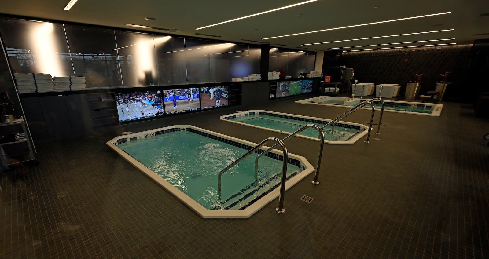 Three pools in the New York Yankees medical and training room are shown during a tour of the upgraded team spring training facilities Thursday, Feb. 13, 2025, at George M. Steinbrenner Field in Tampa, Fla. (AP Photo/Steve Nesius)