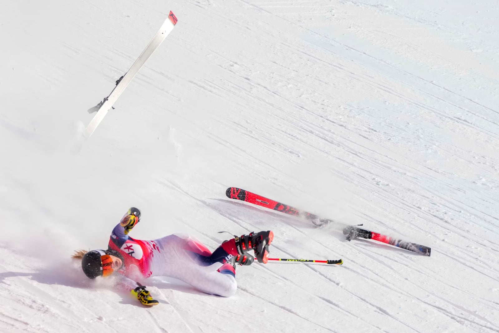 FILE - Nina O'Brien of United States falls during the women's giant slalom at the 2022 Winter Olympics, Monday, Feb. 7, 2022, in the Yanqing district of Beijing. (AP Photo/Mark Schiefelbein, File)