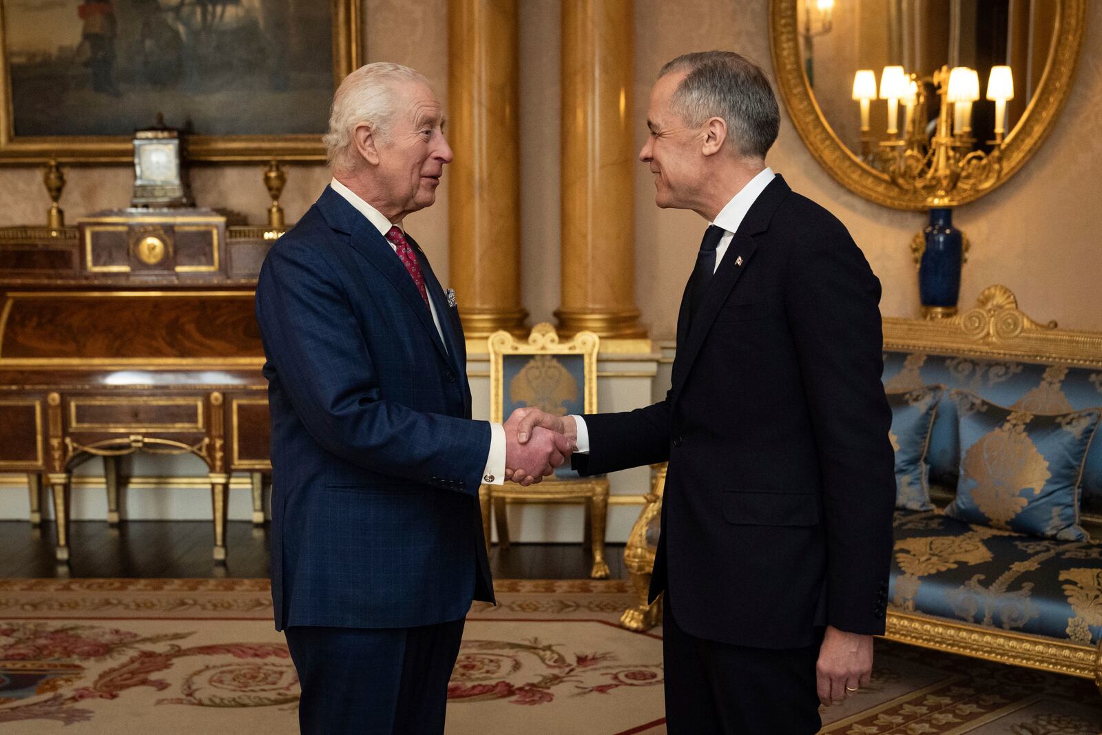 King Charles III, left, holds an audience with Canada's Prime Minister Mark Carney, right, at Buckingham Palace in London, England, Monday, March 17, 2025. (Aaron Chown/PA via AP, Pool)