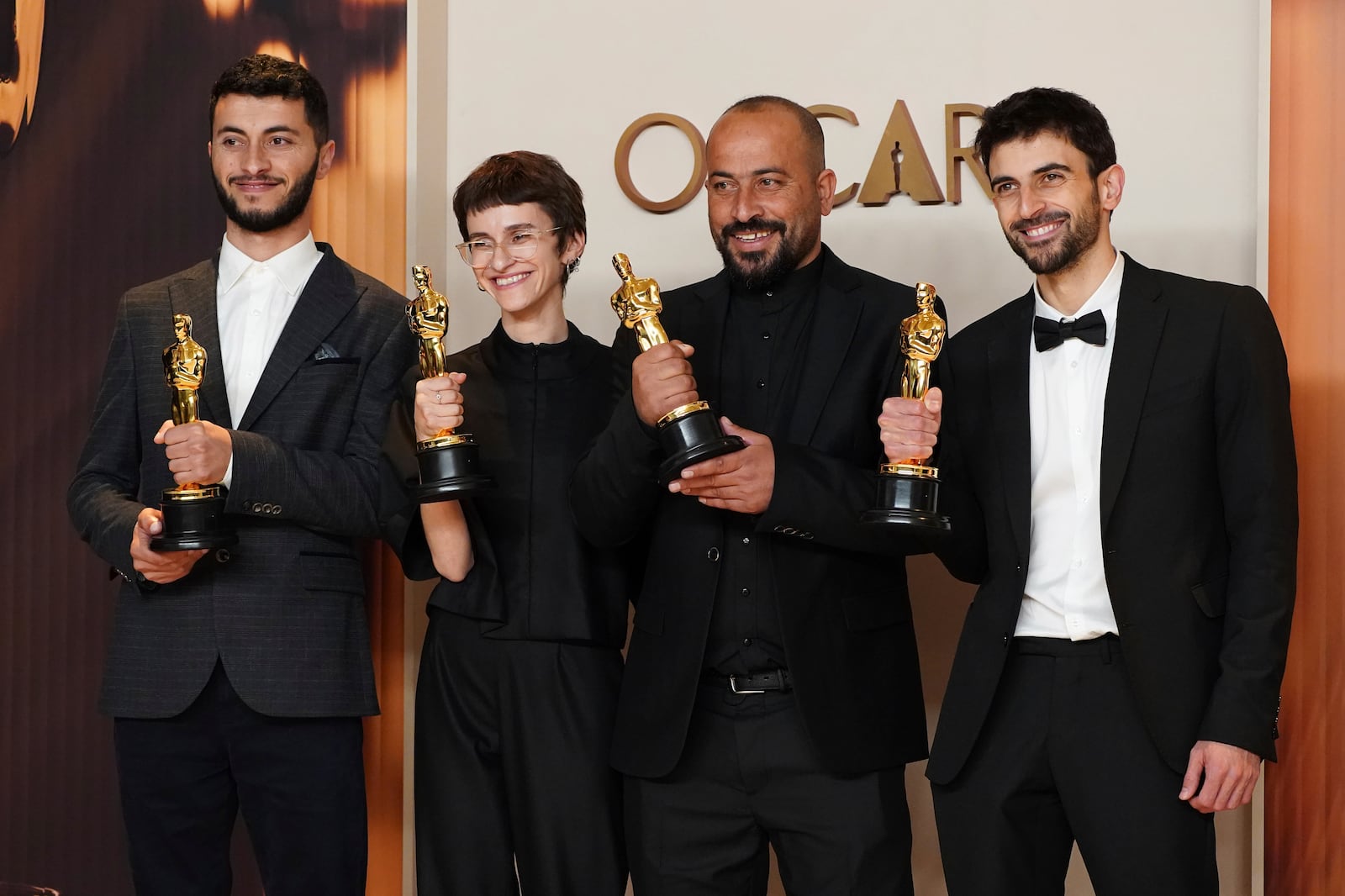 Basel Adra, from left, Rachel Szor, Hamdan Ballal, and Yuval Abraham, winners of the award for best documentary feature film for "No Other Land," pose in the press room at the Oscars on Sunday, March 2, 2025, at the Dolby Theatre in Los Angeles. (Photo by Jordan Strauss/Invision/AP)