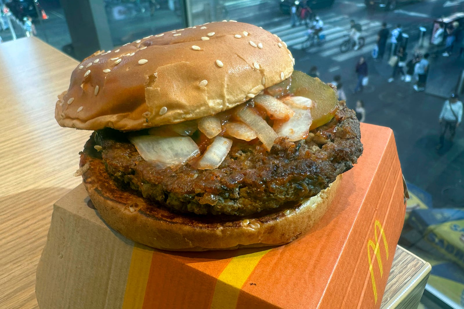 A McDonald's Quarter Pounder hamburger is shown in this photograph, in New York's Times Square, Wednesday, Oct. 23, 2024. (AP Photo/Richard Drew)