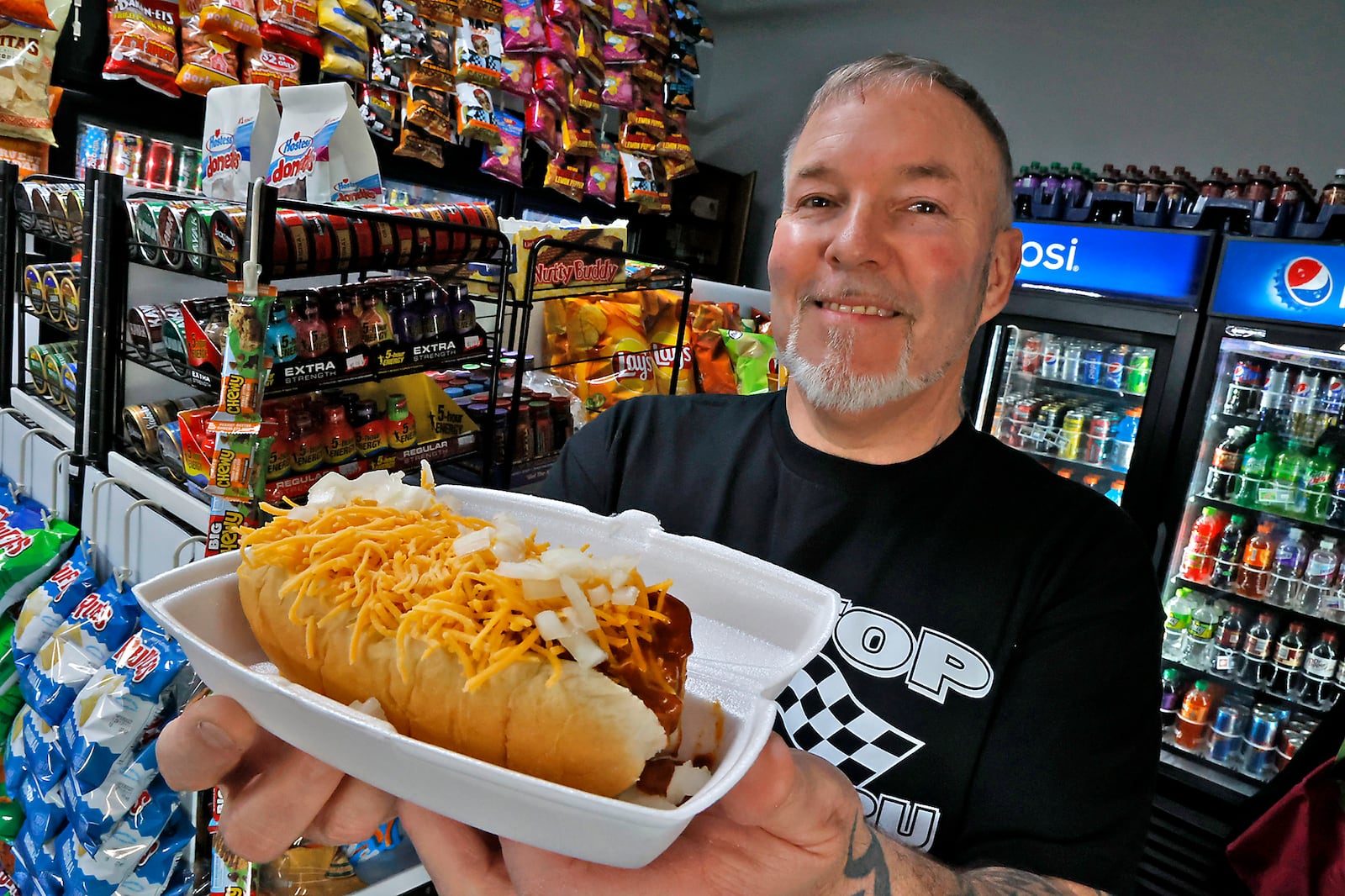 Shane and Tracy Shirk along with their son, Shane Jr., are excited to open Pit Stop Pizza & Subs on April 1, 2023. The restaurant, located on Columbus Avenue in Springfield, has featured a drive thru window since last summer where you can buy convenience store items along with coney dogs and sloppy joe sandwiches but soon will feature a dinning room and offer pizza and sub sandwiches. BILL LACKEY/STAFF