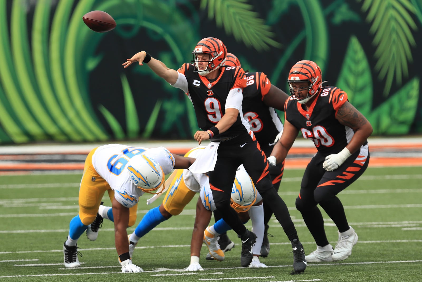 Cincinnati Bengals quarterback Joe Burrow (9) throws during the first half of an NFL football game against the Los Angeles Chargers, Sunday, Sept. 13, 2020, in Cincinnati. (AP Photo/Aaron Doster)