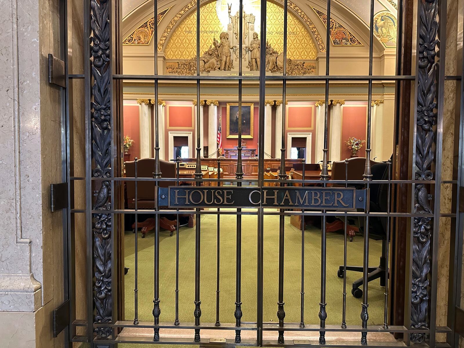 The gate to the Minnesota House of Representatives chamber stands locked on Monday, Jan. 13, 2025, at the State Capitol in St. Paul, one day before the 2025 legislative session is due to convene. (AP Photo/Steve Karnowski)