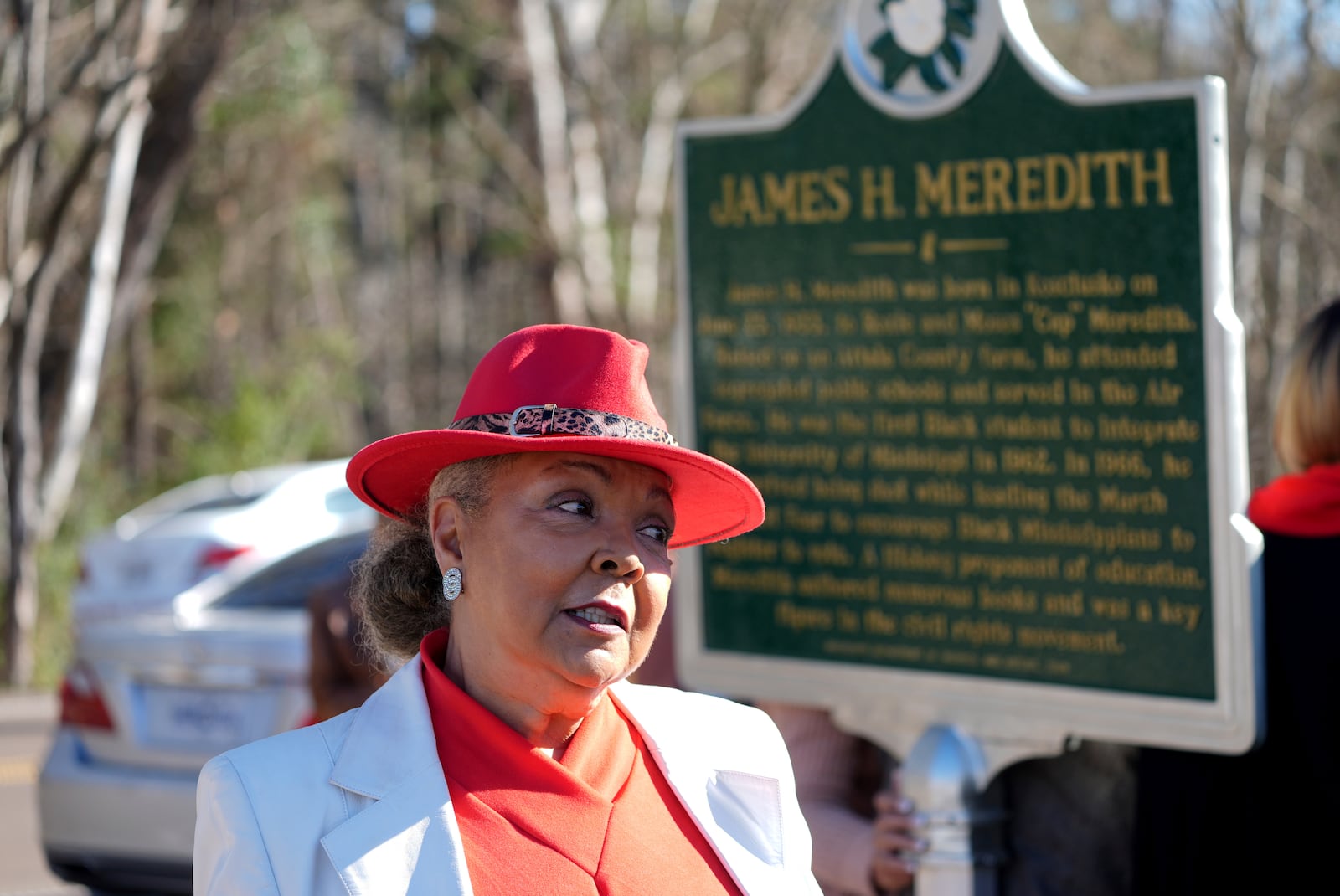 Judy Alsobrooks Meredith, wife of James Meredith, who became the first Black student to enroll at the University of Mississippi in 1962, stands before a Mississippi Department of Archives and History marker recognizing his birthplace and his legacy in Kosciusko, Miss., Friday, Dec. 20, 2024. (AP Photo/Rogelio V. Solis)