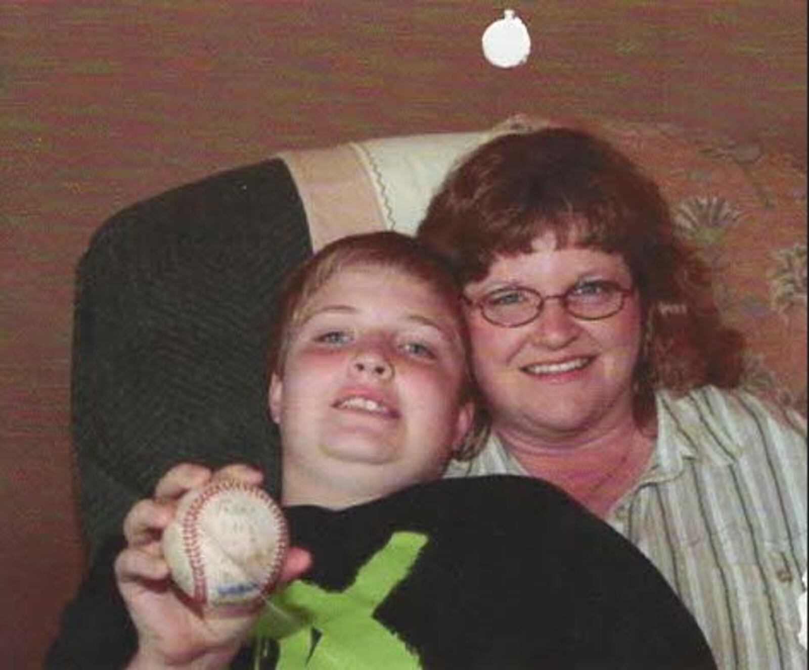 Taylor Duncan and his mother. Now 25, Duncan is CEO of Alternative Baseball, which is seeking to start a team in Dayton. CONTRIBUTED