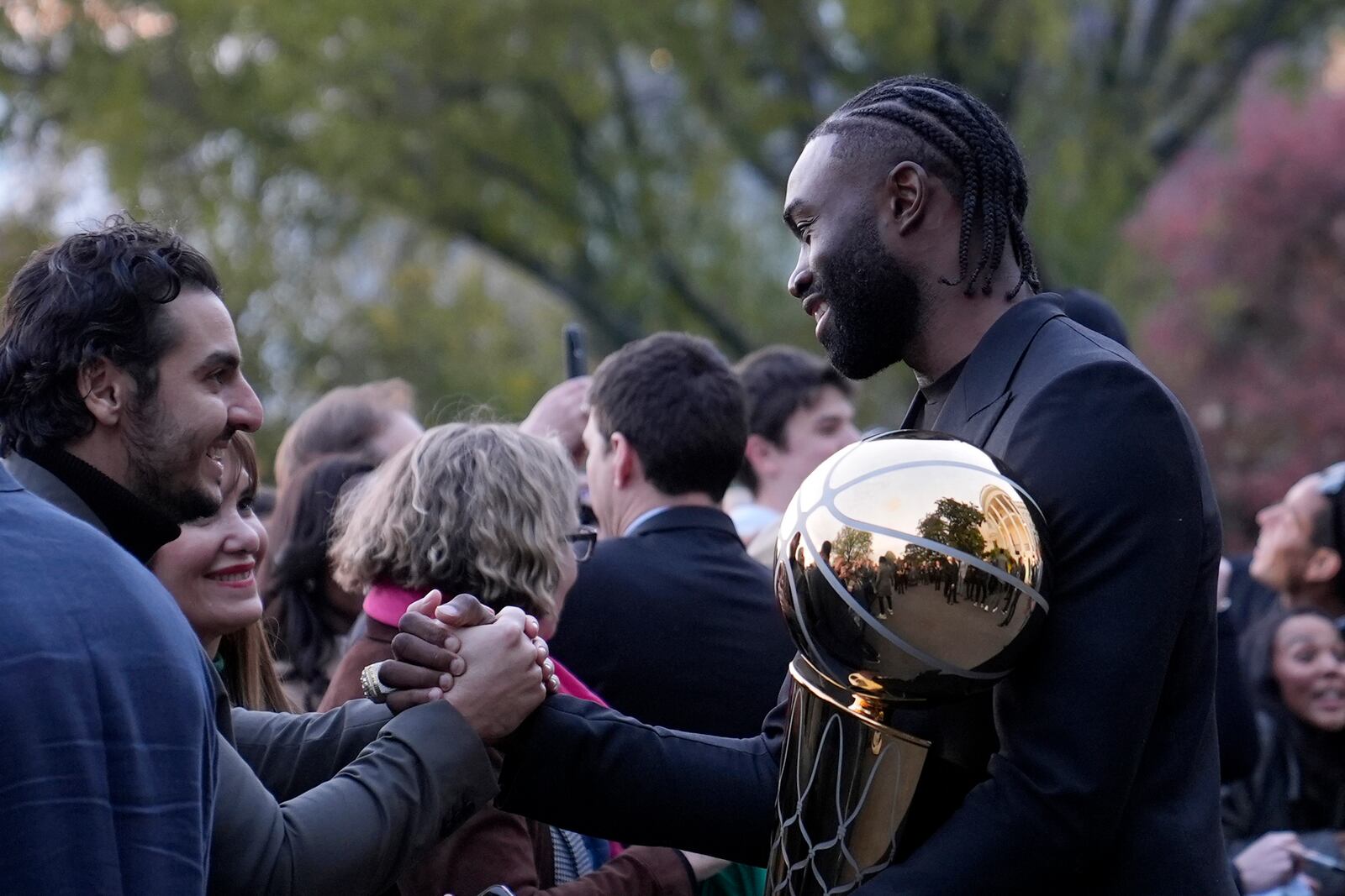 Boston Celtics Jaylen Brown talk with people following an event with President Joe Biden to celebrate the Celtics victory in the 2024 National Basketball Association Championship, on the South Lawn of the White House in Washington, Thursday, Nov. 21, 2024. (AP Photo/Susan Walsh)