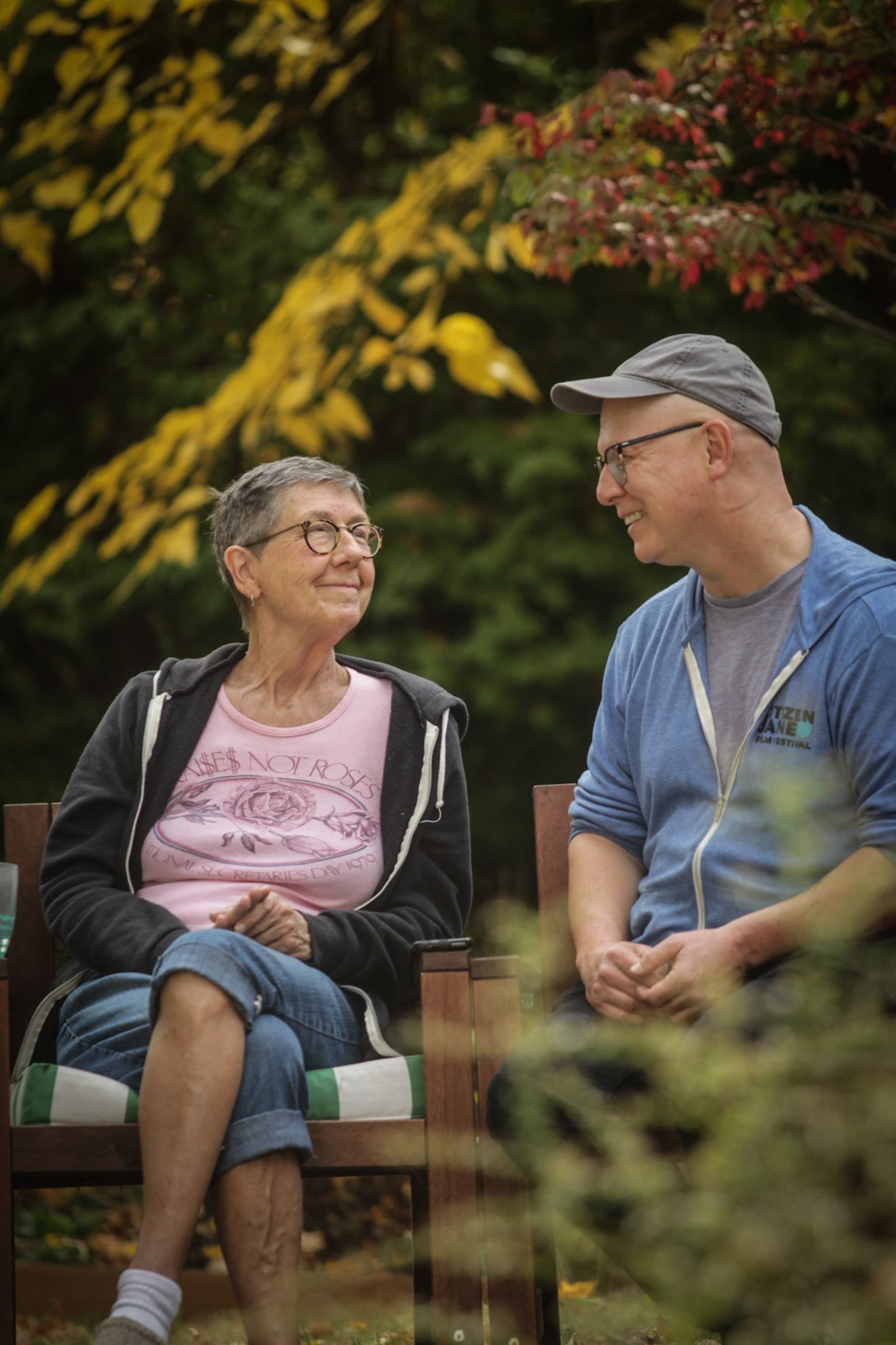 Yellow Springs residents Julia Reichert and Steven Bognar are planning on releasing their new documentary, "9 to 5: The Story of a Movement." Here, they chat outside their home with Dayton Daily News reporter Sarah Franks. JIM NOELKER/STAFF 