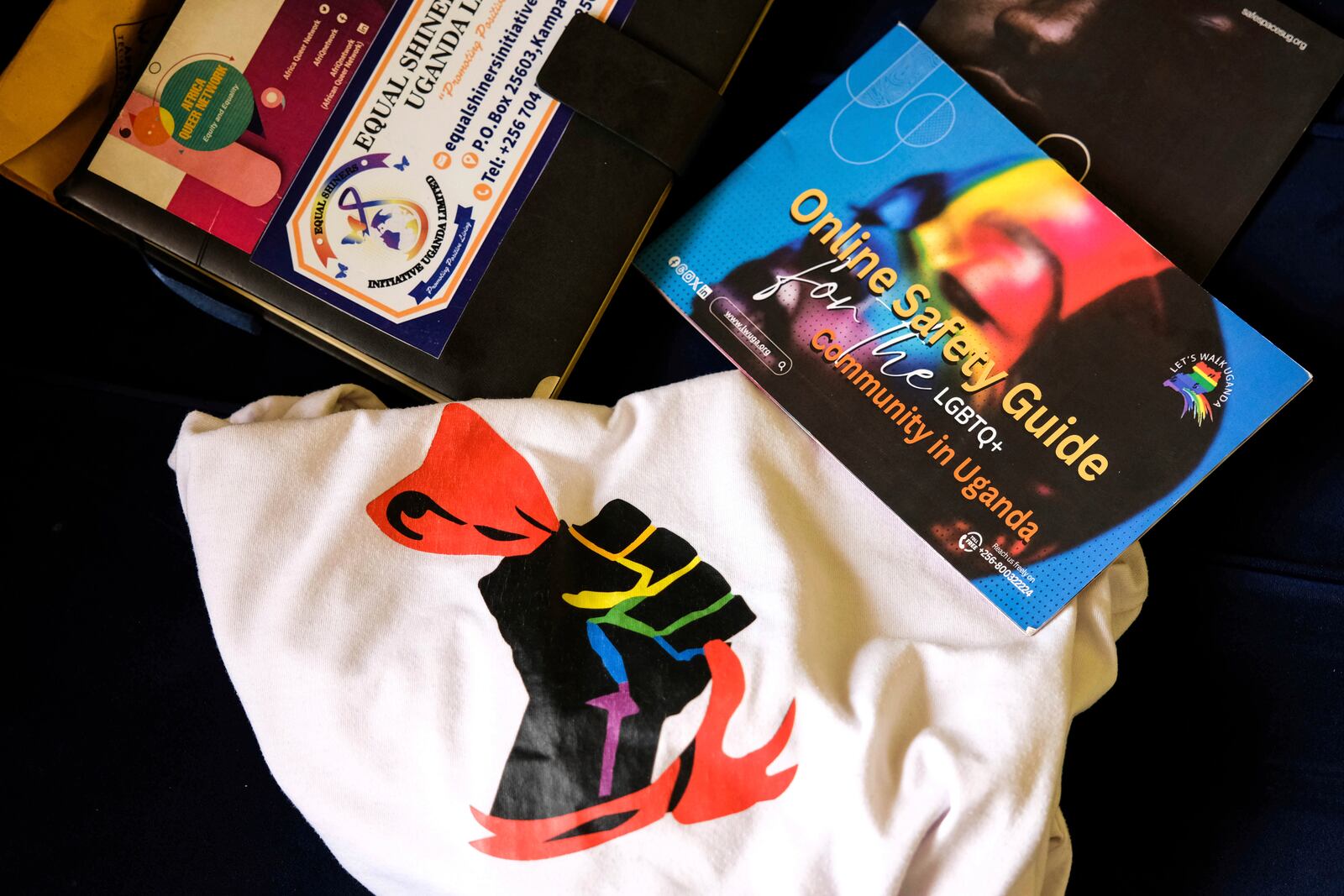 This shows an LGBTQ+ online safety guide book at the home of Ugandan human rights activist Kennedy Pius in Kampala, Uganda, Jan. 28, 2025. (AP Photo/Hajarah Nalwadda)