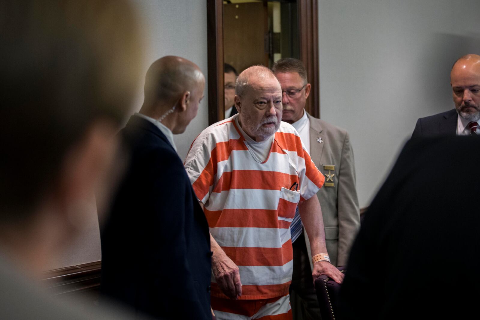 Greg McMichael returns to the courtroom during short break in a hearing challenging his trial, Thursday, Oct. 24, 2024, in Brunswick, Ga. (AP Photo/Stephen B. Morton)