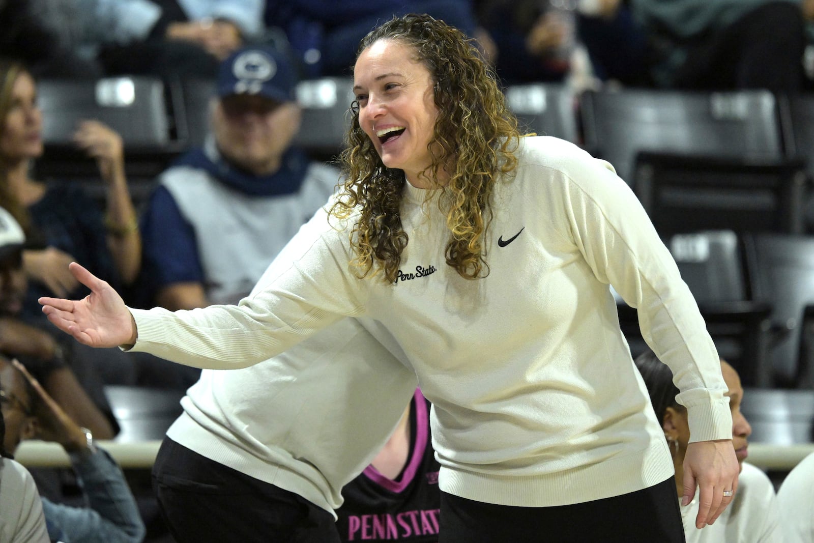 Penn State head coach Carolyn Kieger smiles on the bench during the second half of an NCAA college basketball game against UCLA, Wednesday, Jan. 15, 2025, in Los Angeles. (AP Photo/Jayne Kamin-Oncea)