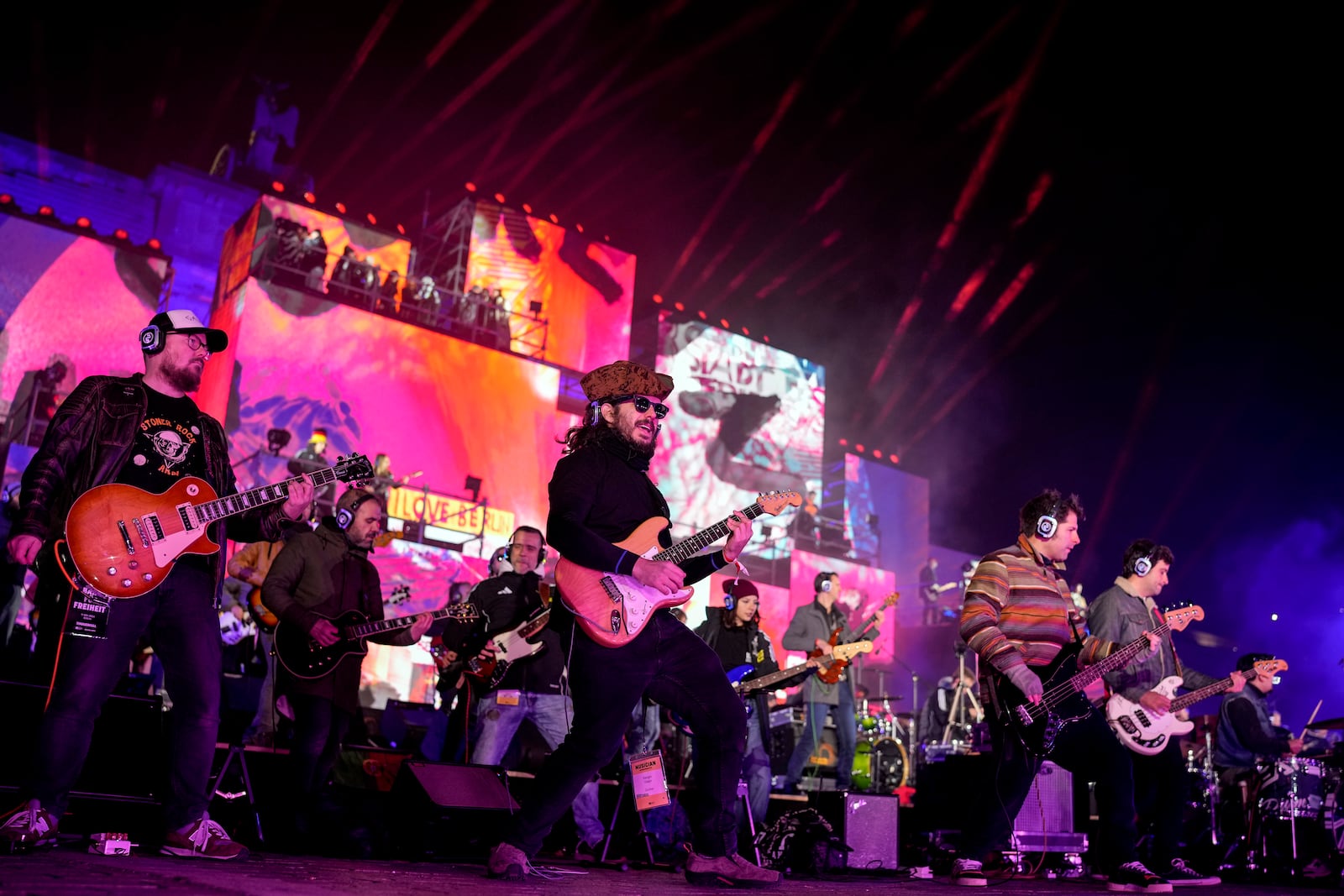 Musicians play on the stage during the concert for freedom for the 35th anniversary of the fall of the Berlin Wall, at the Brandenburg Gate in Berlin, Germany, Saturday, Nov. 9, 2024. (AP Photo/Ebrahim Noroozi)