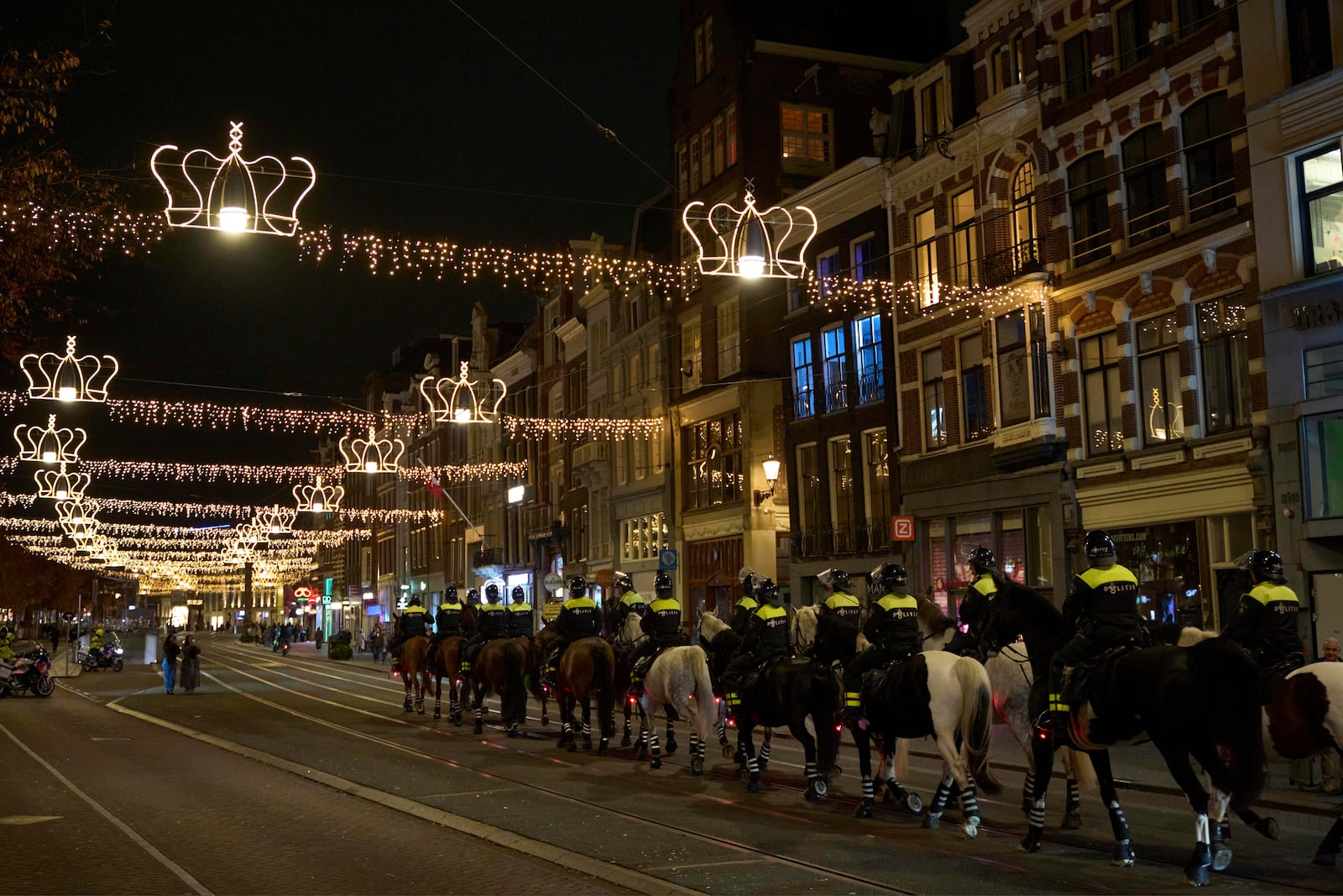 Police forces leave the Dam square after shutting down a pro-Palestinian protest at the square in Amsterdam, Netherlands, Wednesday, Nov. 13, 2024. (AP Photo/Bram Janssen)