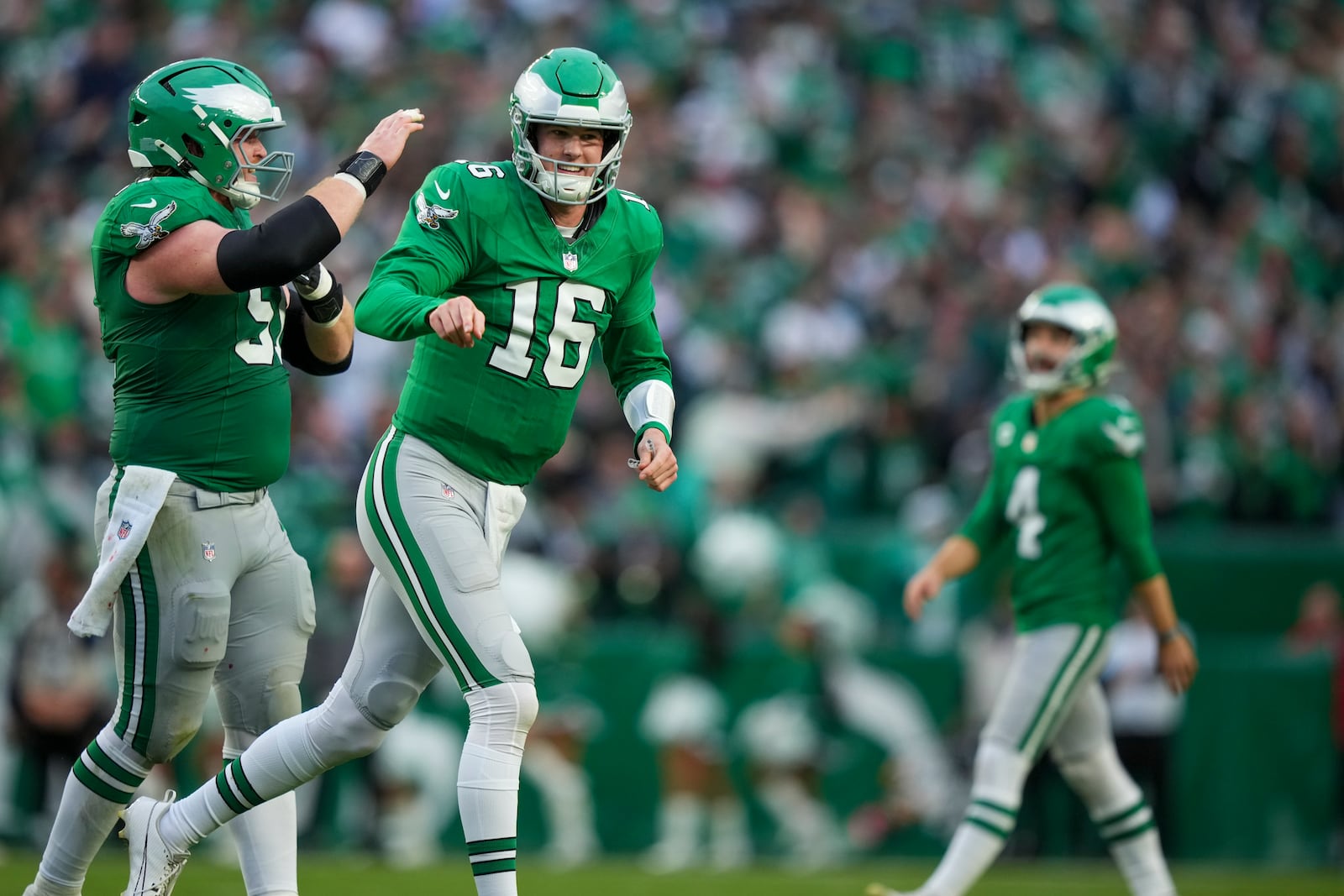 Philadelphia Eagles quarterback Tanner McKee (16) reacts after throwing a touchdown pass to wide receiver DeVonta Smith during the second half of an NFL football game against the Dallas Cowboys, Sunday, Dec. 29, 2024, in Philadelphia. (AP Photo/Matt Slocum)