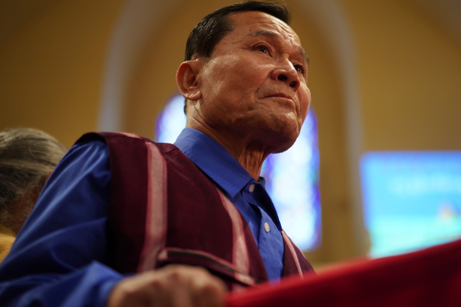 A parishioner takes offerings during Karen-language service at Indian lake Baptist Church in Worthington, Minn., on Sunday Oct. 20, 2024. (AP Photo/Jessie Wardarski)