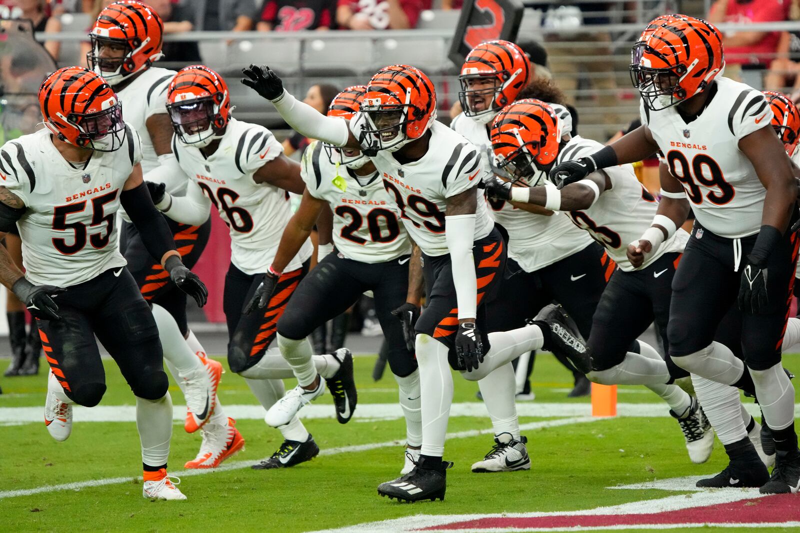 Cincinnati Bengals cornerback Cam Taylor-Britt (29) celebrates his interception for a touchdown against the Arizona Cardinals during the second half of an NFL football game, Sunday, Oct. 8, 2023, in Glendale, Ariz. (AP Photo/Rick Scuteri)