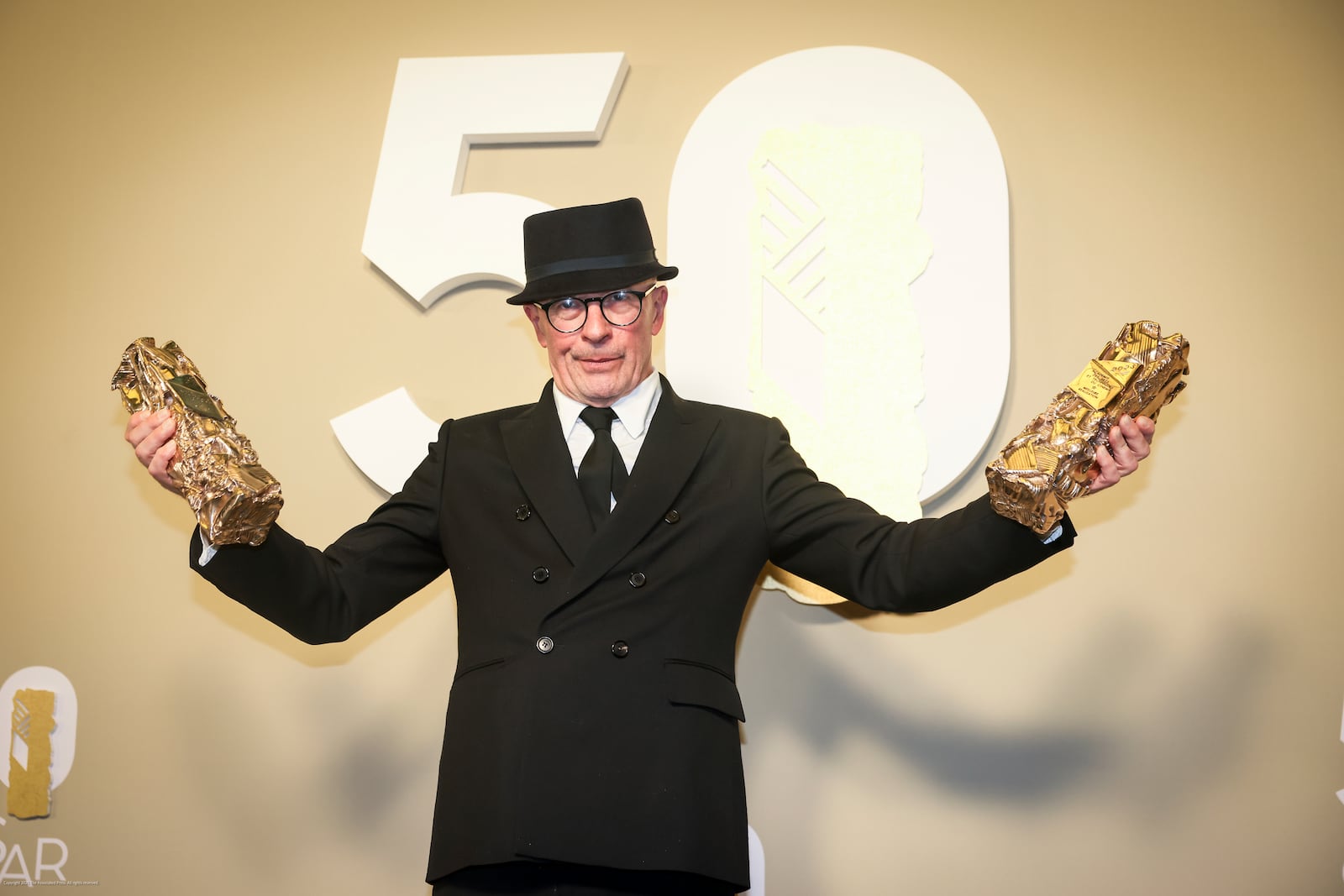 Jacques Audiard poses after receiving awards for the movie "Emilia Pérez" during the 50th Cesar Awards ceremony in Paris, Friday, Feb. 28, 2025. (AP Photo/Thomas Padilla)