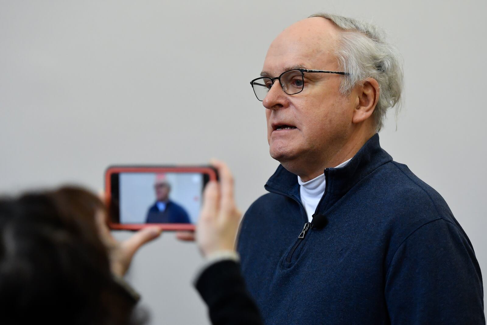 Steve Davies, of Brooklyn, is interviewed by media outside Chautauqua County court in Mayville, N.Y., Thursday, Feb. 20, 2025. Davies, who witnessed the 2022 knife attack on author Salman Rushdie, was in court as a spectator. (AP Photo/Adrian Kraus)