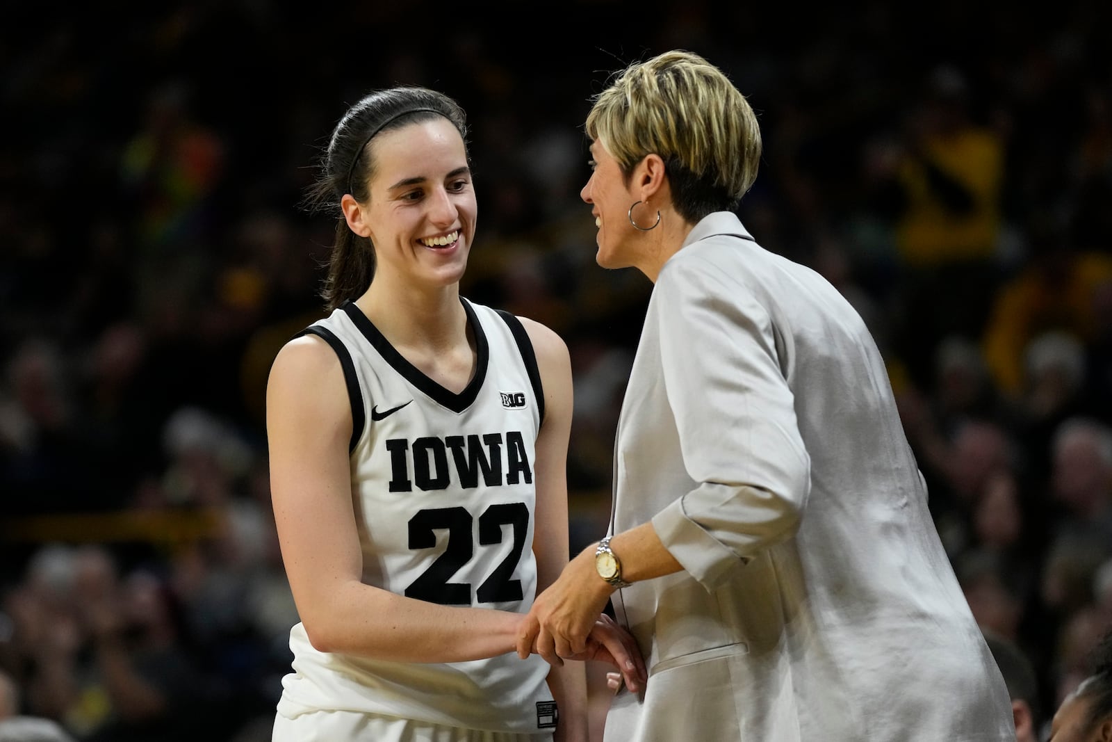 FILE - Iowa guard Caitlin Clark talks with assistant coach Jan Jensen during the second half of an NCAA college basketball game against Drake, Nov. 19, 2023, in Iowa City, Iowa. (AP Photo/Charlie Neibergall, file)